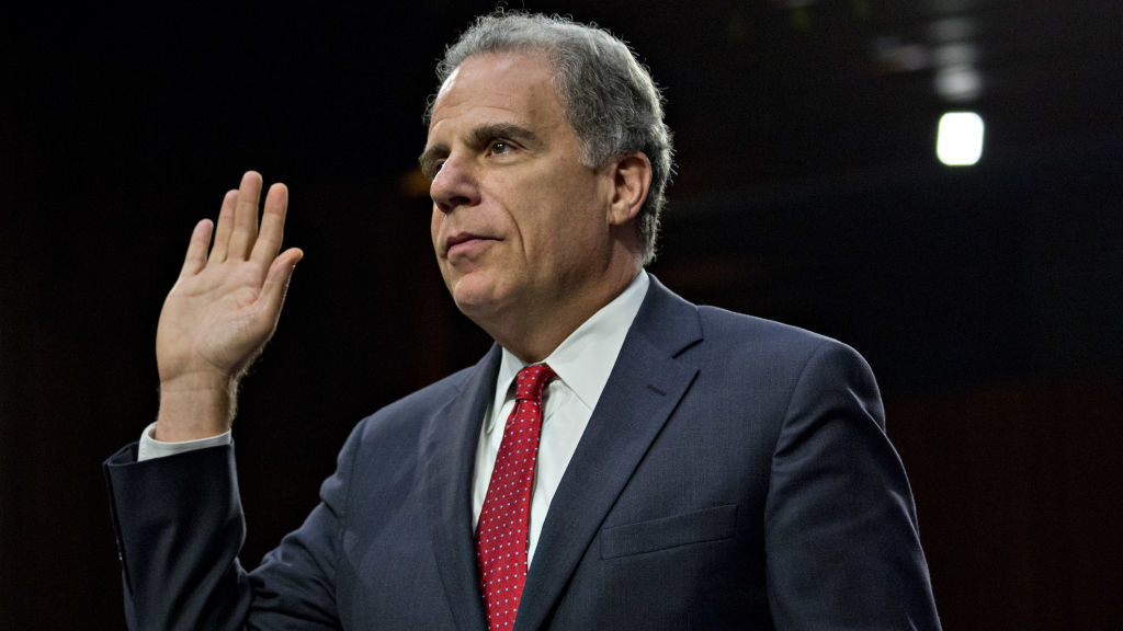 Michael Horowitz, the Department of Justice inspector general, swears in to a Senate Judiciary Committee hearing last year. (Bloomberg via Getty Images)