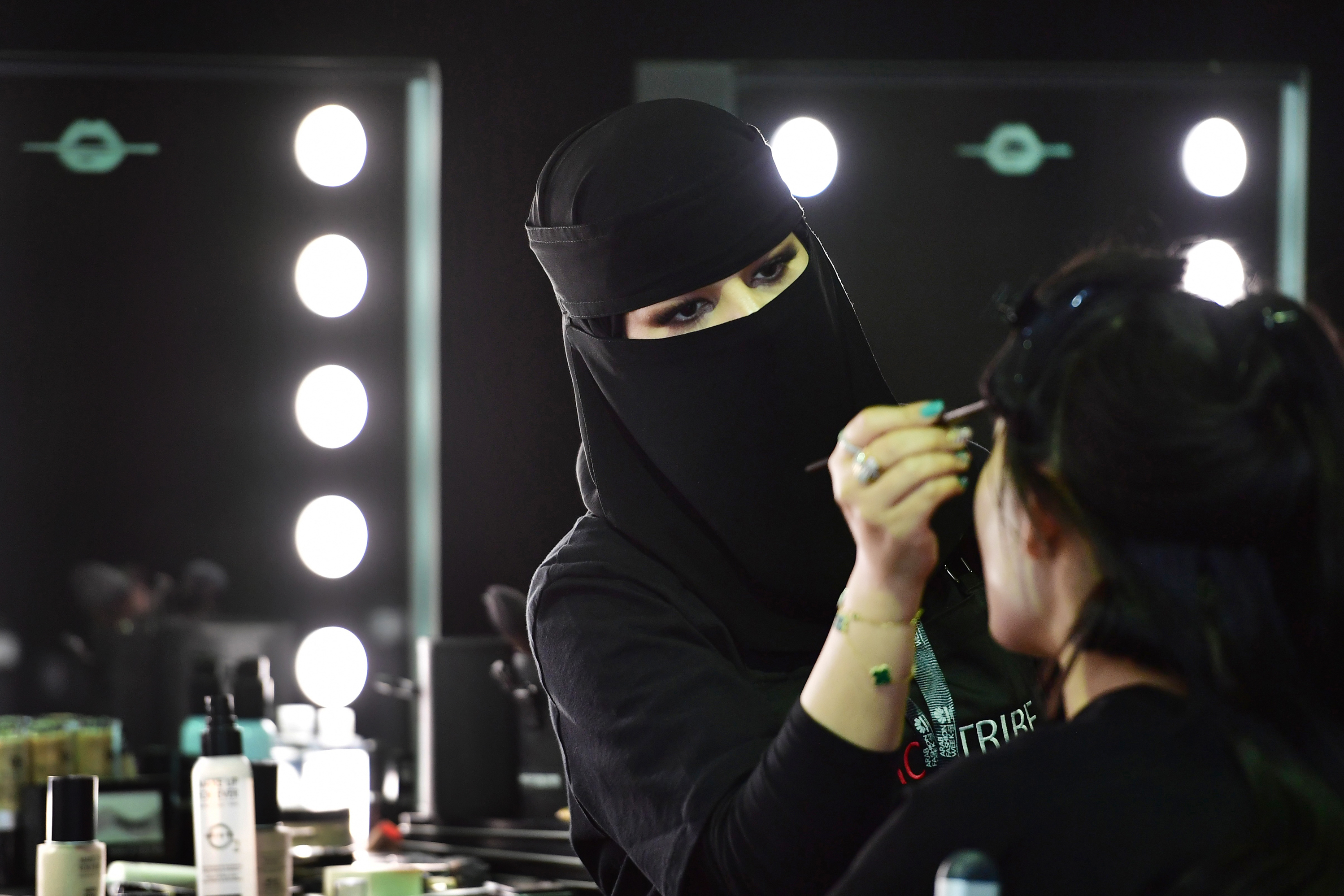 A Saudi makeup artist preps a model backstage during Saudi Arabia's first Arab Fashion Week in Riyadh. (AFP/Getty Images)