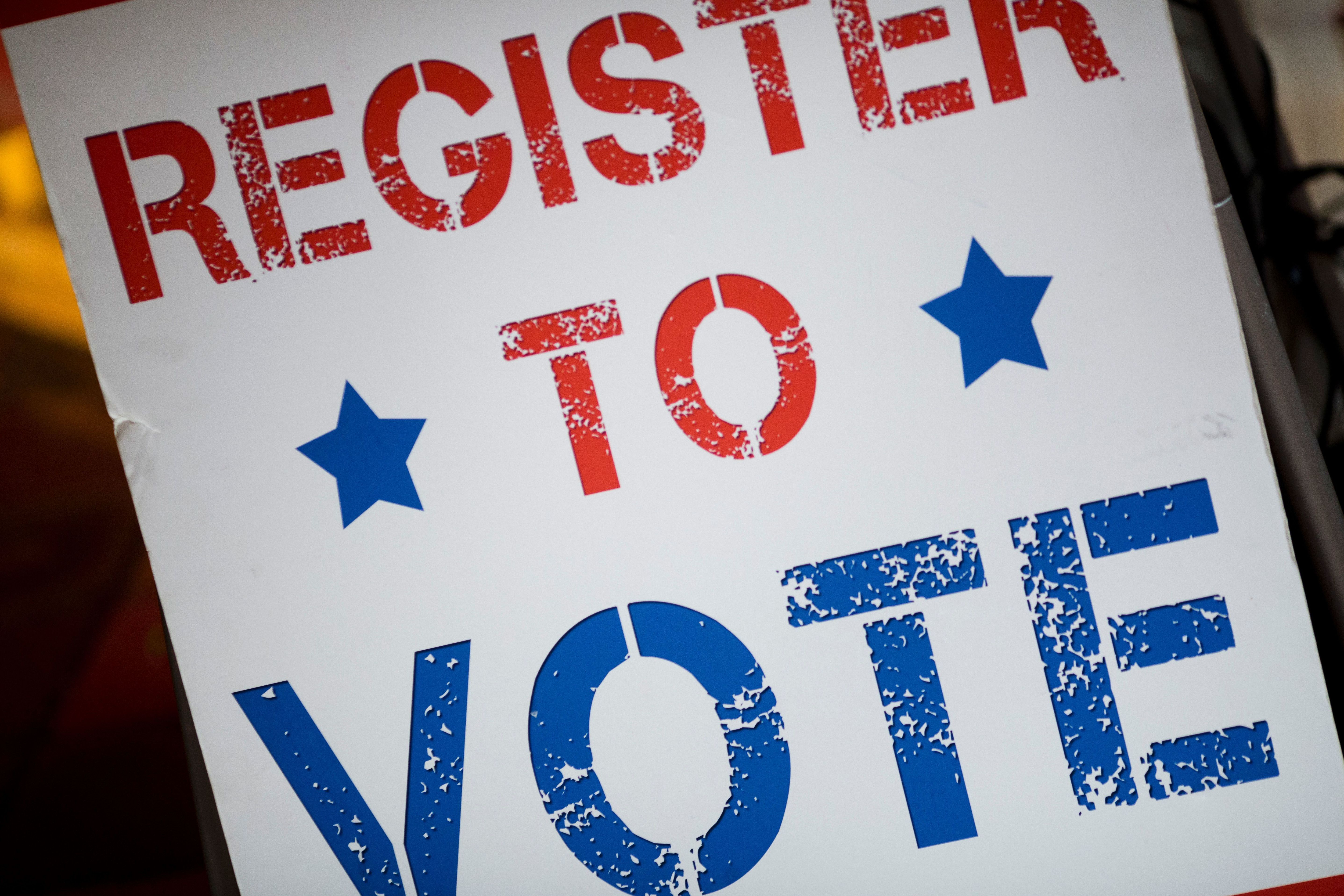 A dozen states have moved or are moving to automatic voting registration. (AFP/Getty Images)