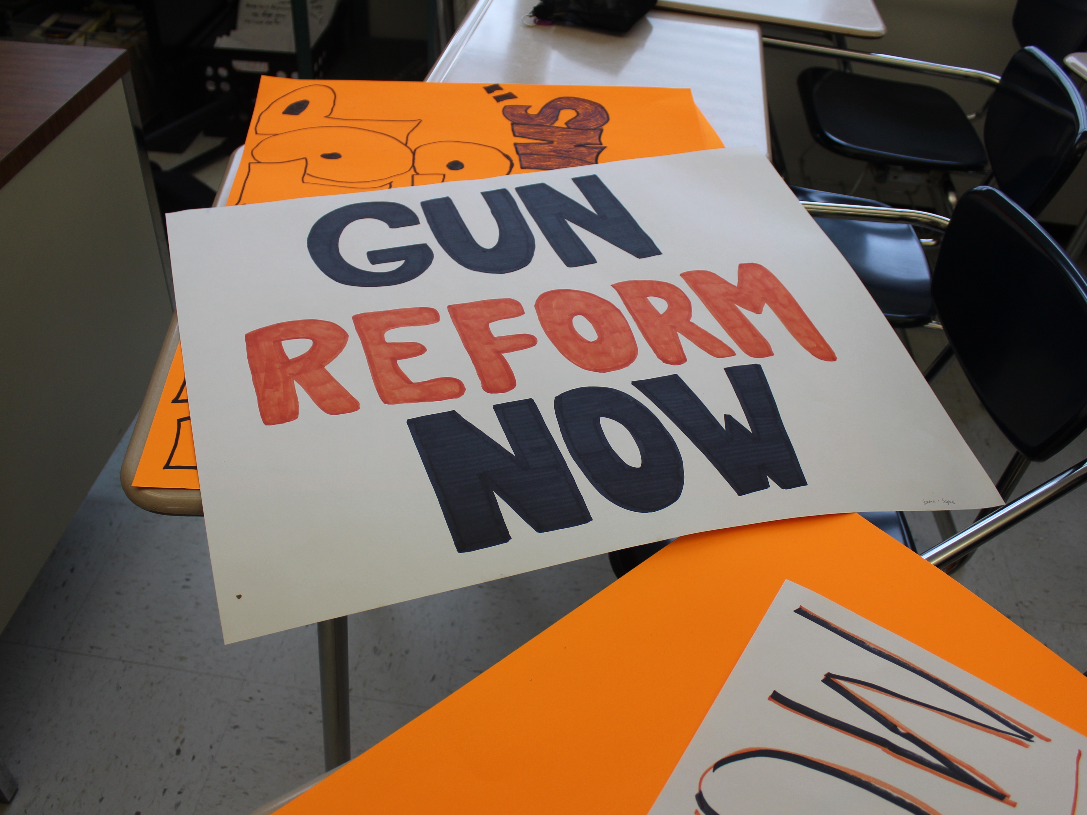One poster made by students at Ridgefield High School in Connecticut for the school walkout.