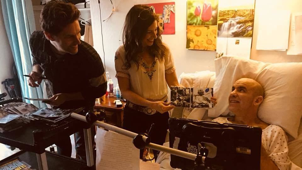 Bernie Dalton (right) and Essence Goldman (center) signing copies of Bernie And The Believer's album <em>Connection</em> (Courtesy of Essence Goldman)