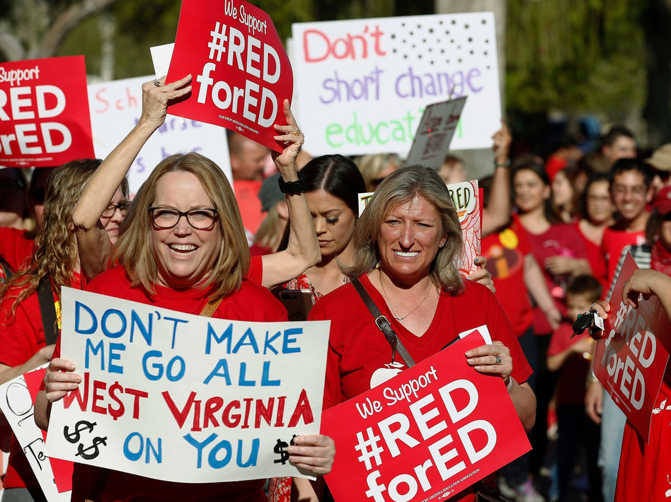 Arizona teachers and education advocates march at the Arizona Capitol protesting low teacher pay and school funding in Phoenix. (Ross D. Franklin/AP)