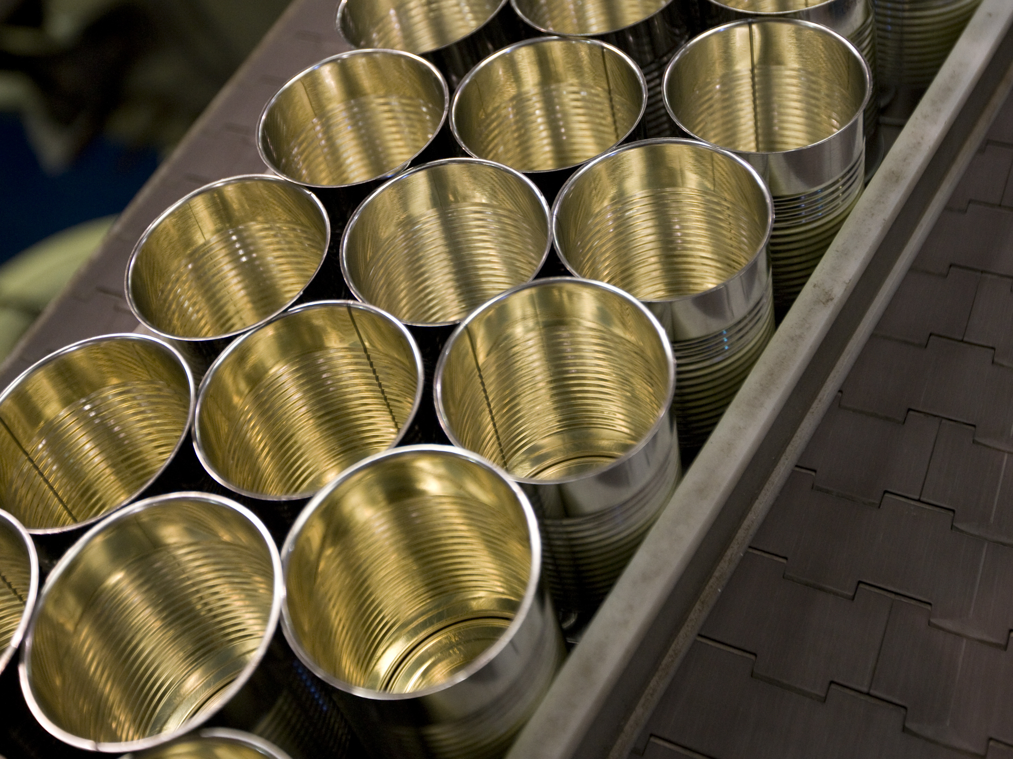 Cans are lined up at the Pacific Coast Producers plant in Oroville, Calif. The company, which cans fruits for sale in supermarkets, says new tariffs imposed by the Trump administration on steel imports will eat into its profits. (Rick King Design)