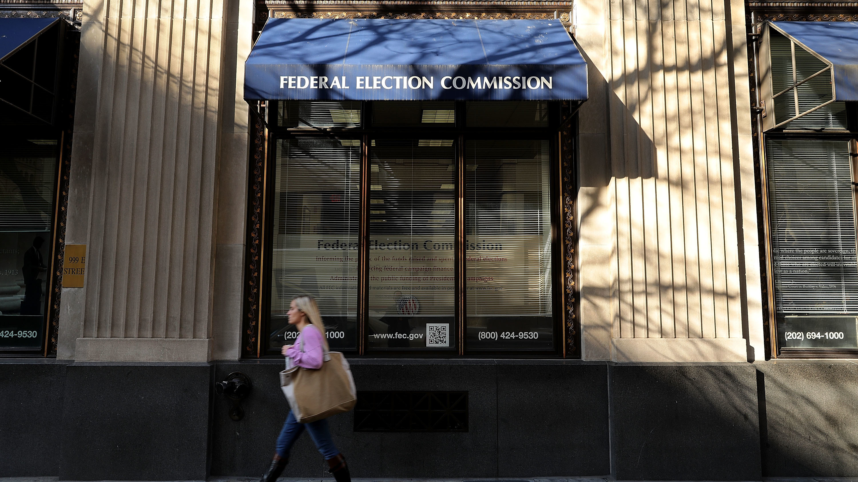 A pedestrian walks past the Federal Election Commission's headquarters October 24, 2016 in Washington, DC. (Getty Images)