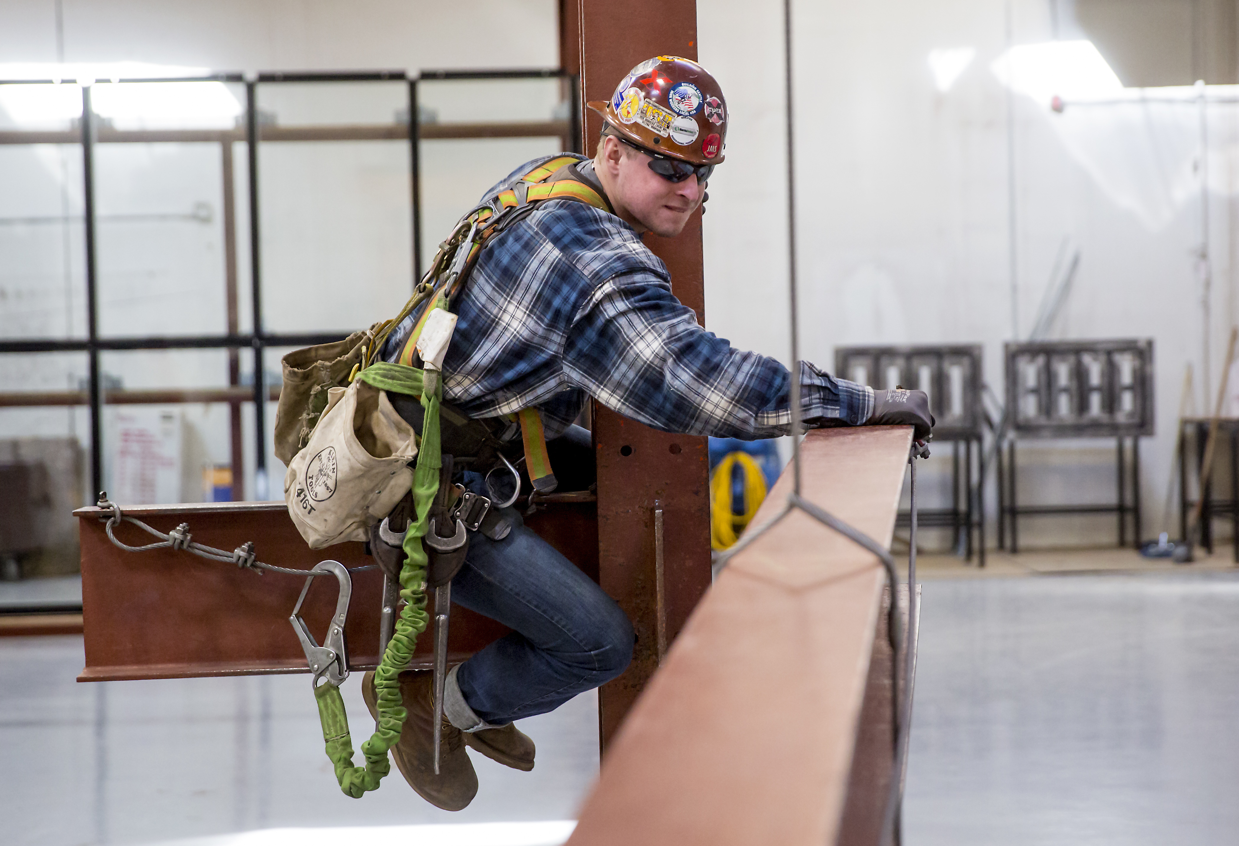Taylor Fawcett, 23, moves a column during a connector mockup drill at the Iron Workers Local Union #86 Administrative Offices in Tukwila, Wash.