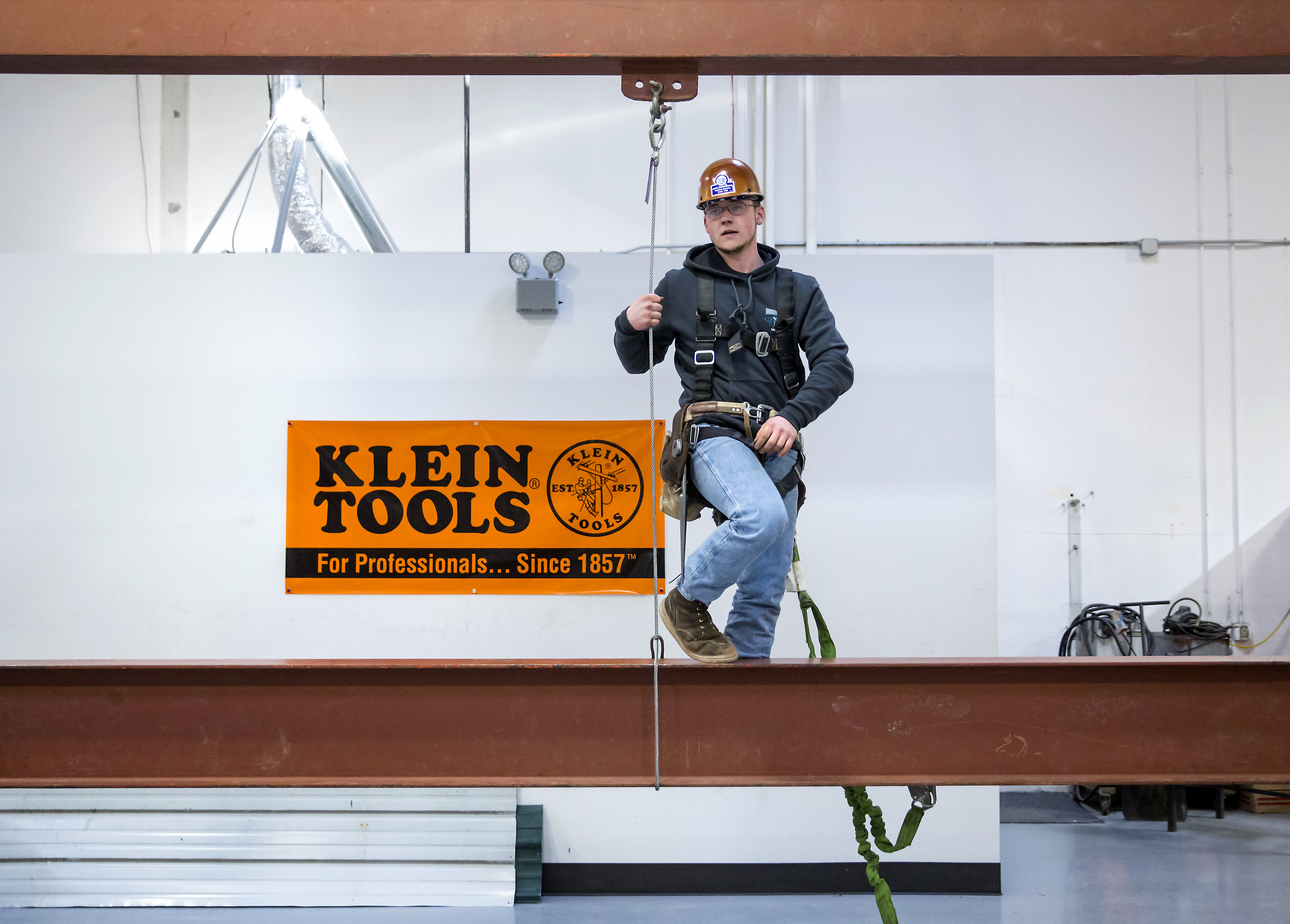 Darren Redford, 20, looks to his instructor after completing a connector mockup drill at the Iron Workers Local Union #86 Administrative Offices in Tukwila, Wash.