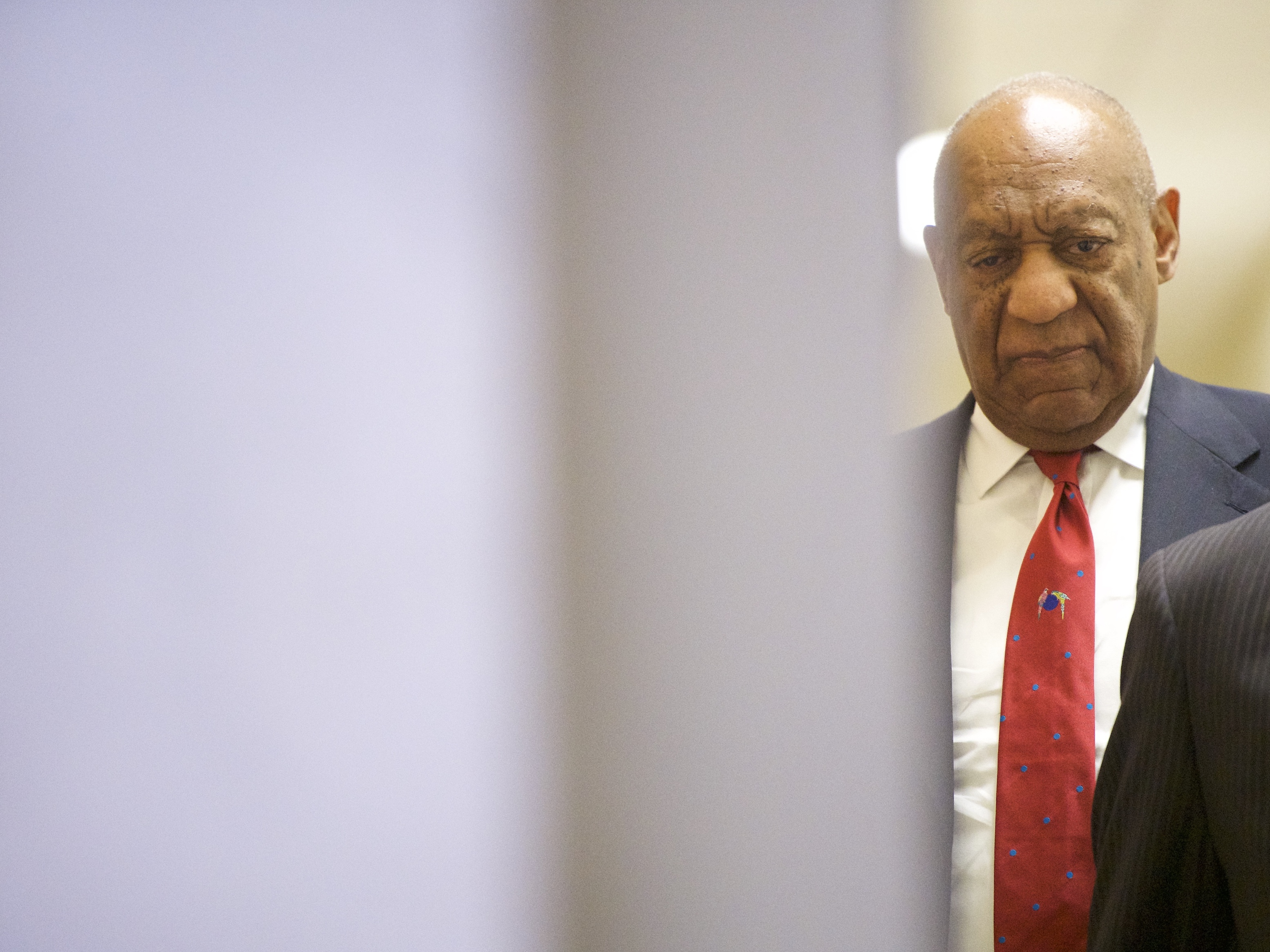 Bill Cosby walks after it was announced a verdict is in at the Montgomery County Courthouse for day fourteen of his sexual assault retrial on April 26, 2018 in Norristown, Pennsylvania. (Getty Images)