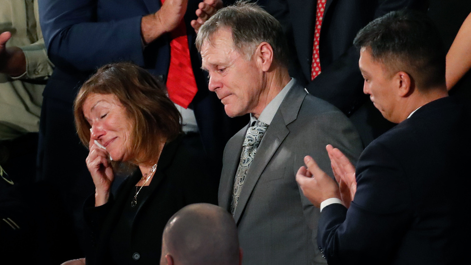 The teary-eyed parents of Otto Warmbier, the American student who died days after being freed from imprisonment in North Korea, react to a standing ovation during President Trump's State of the Union address to a joint session of Congress on Jan 30. The parents filed a wrongful death lawsuit against North Korea on Thursday, saying its government tortured and killed their son. (Pablo Martinez Monsivais/AP)