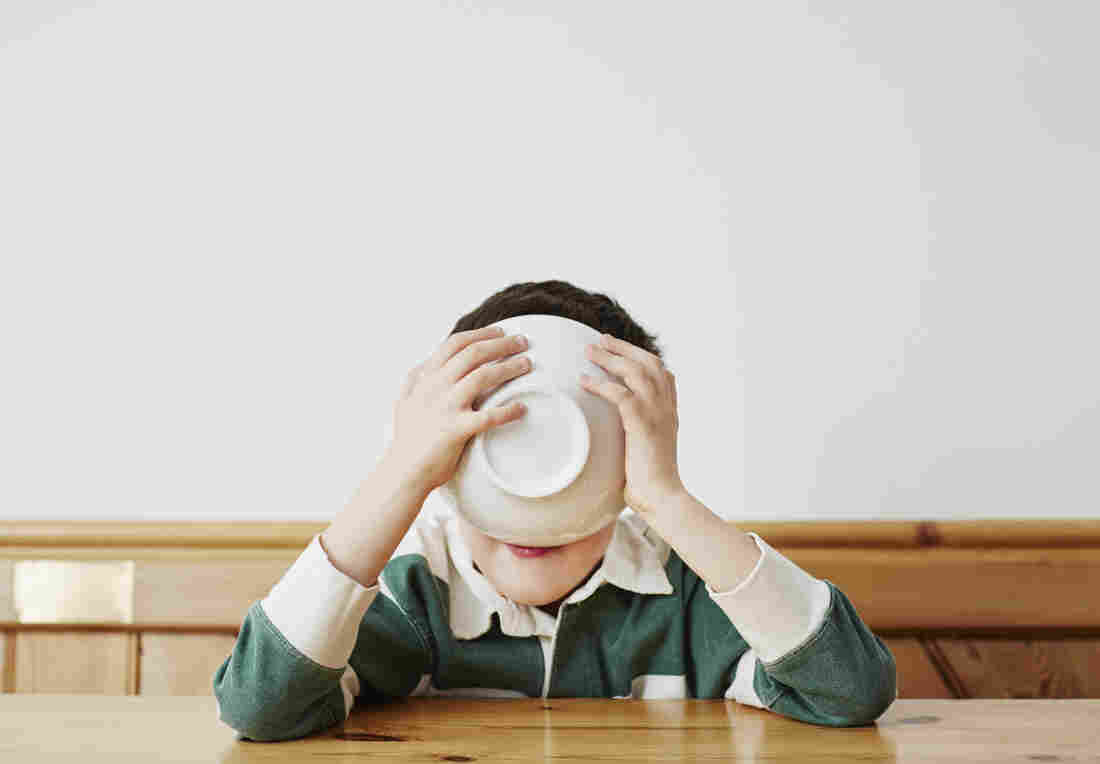 Boy drinking milk from bowl