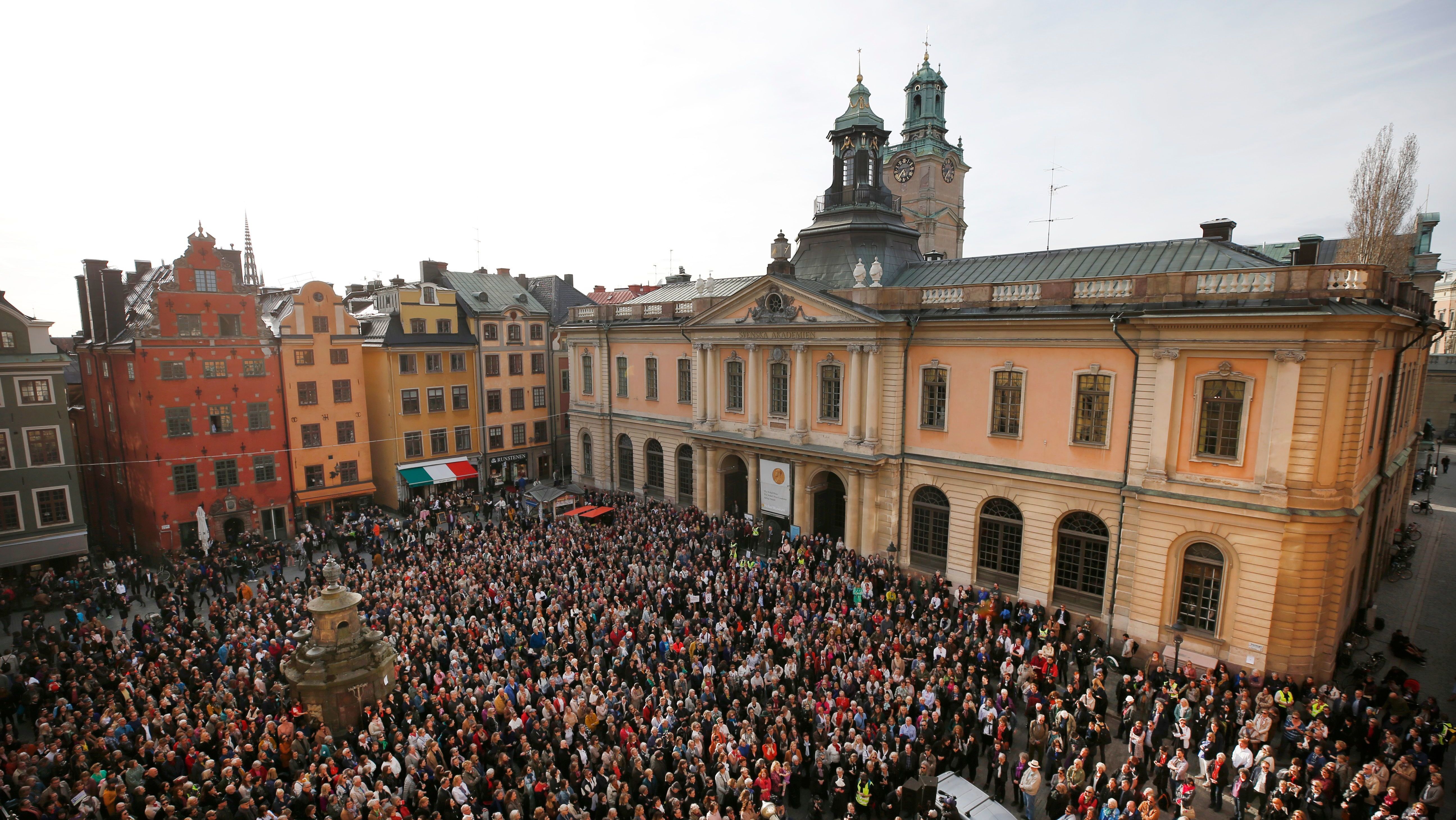 Protesters gathered earlier this month outside Stockholm's Old Stock Exchange building, where the Swedish Academy meets. Demonstrators showed support for resigned Permanent Secretary Sara Danius by wearing her hallmark tied blouse. (AFP/Getty Images)