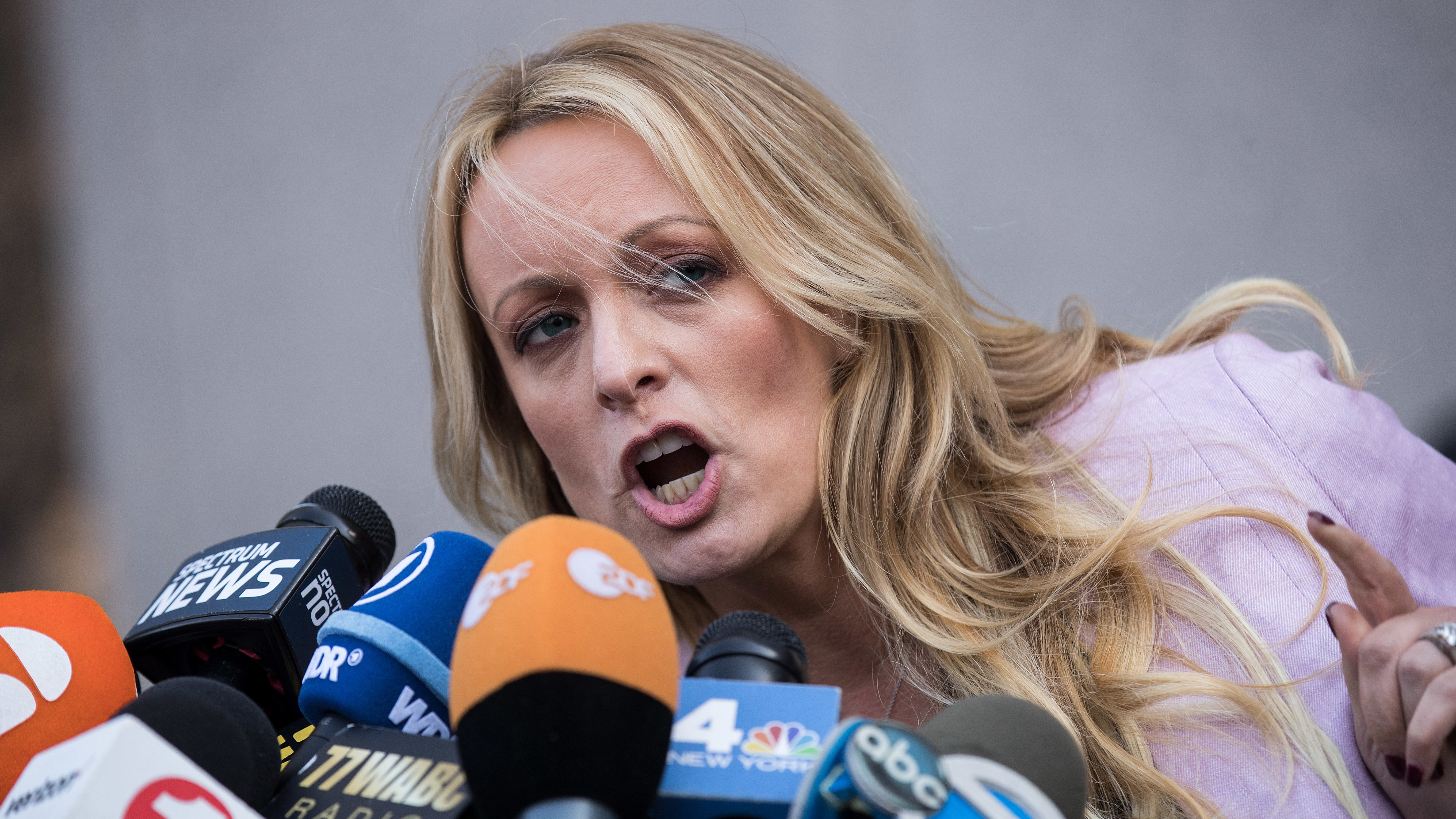 Adult film actress Stormy Daniels speaks to reporters as she exits a federal courthouse in New York City after a hearing related to Michael Cohen, President Trump
