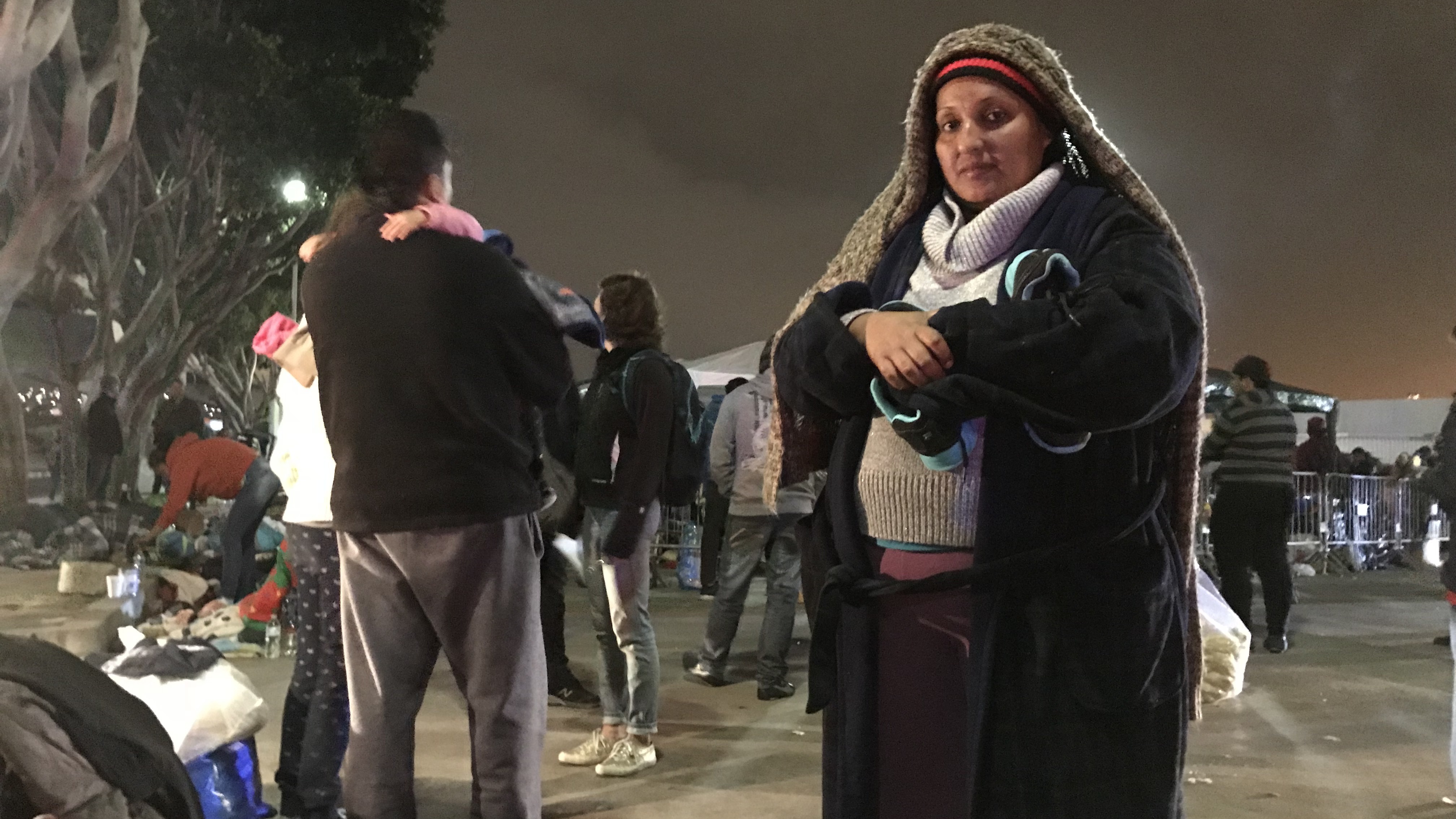 Deana Quczada of Honduras has been camping with her young children on the street in Tijuana for several days. Going back to the violence in her home country is not an option, she says. (NPR)