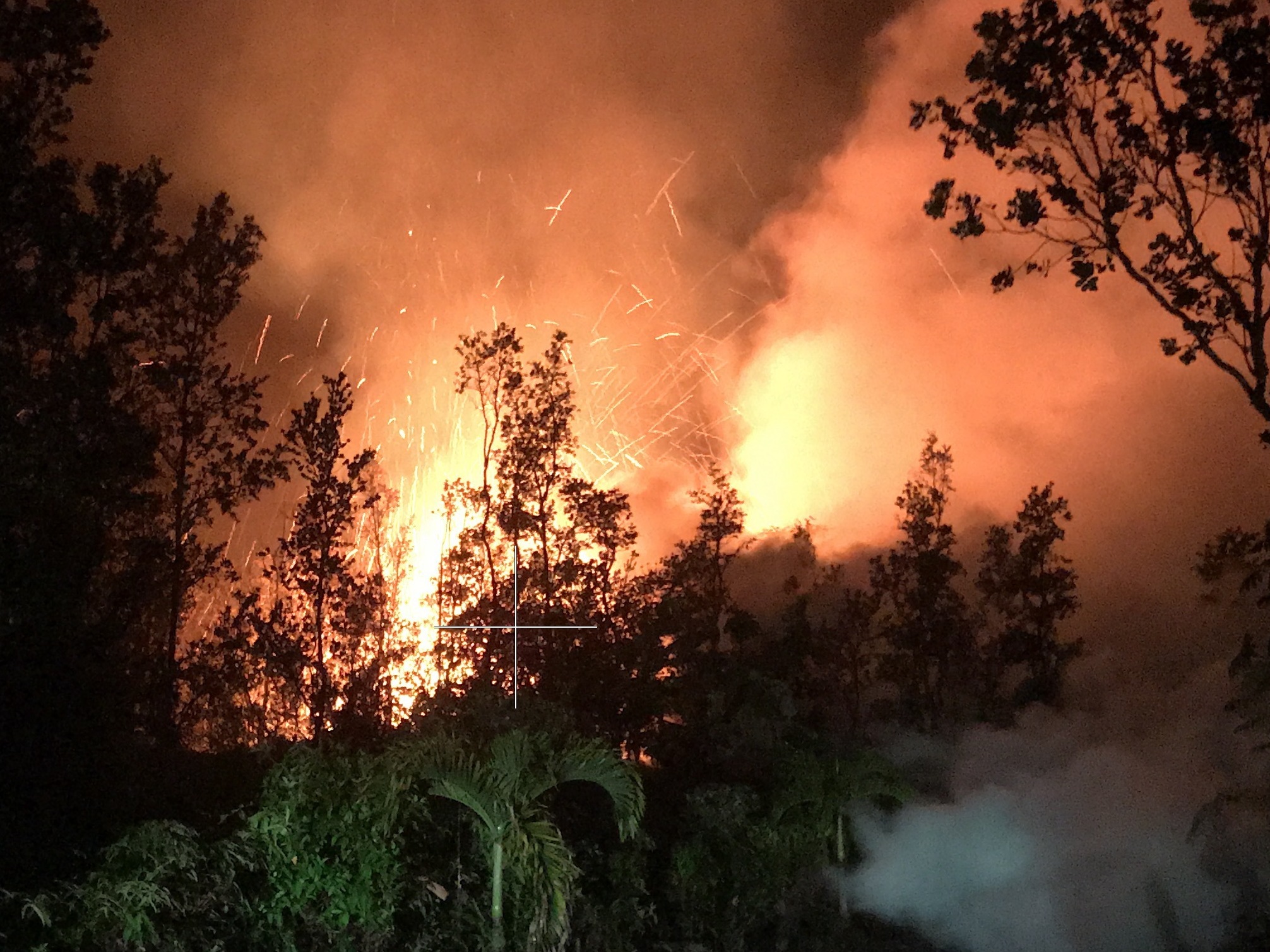 A new lava vent opened up on a residential street in the Leilani Estates neighborhood near Kīlauea volcano Friday morning. Spatter was being thrown nearly 100 feet high at the time the photo was made. (U.S. Geological Survey)