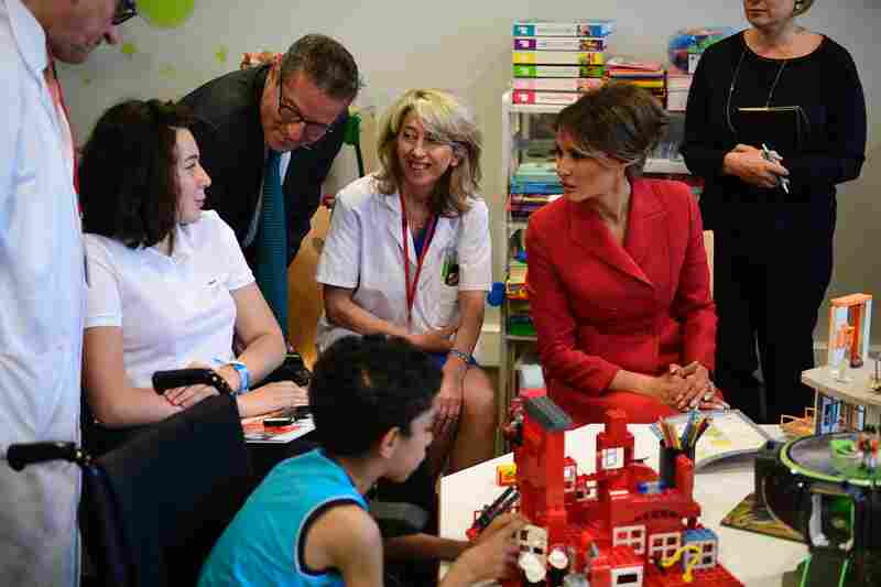 Melania Trump speaks with people during a visit to the Necker Hospital in Paris, on July 13, 2017.