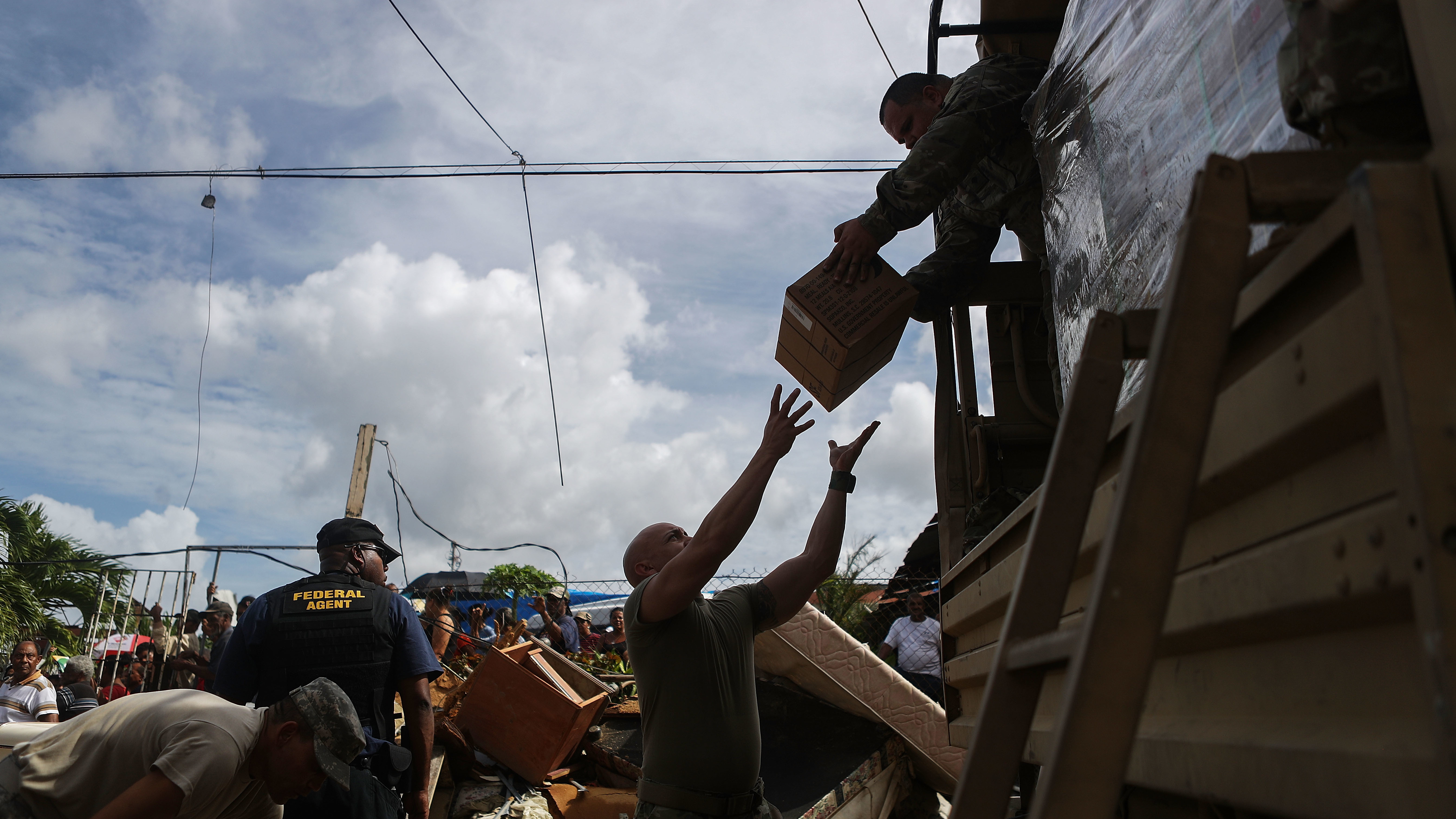 U.S. Army soldiers in Puerto Rico unload food on Oct. 17, 2017. Nearly a month after Hurricane Maria hit, the federal government was still delivering basic supplies, like food and water. (Getty Images)