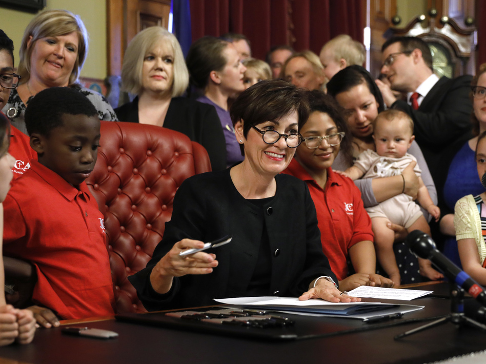 Iowa Gov. Kim Reynolds signed the controversial abortion bill into law on Friday, setting the state up for a lengthy challenge in court. (Charlie Neibergall/AP)
