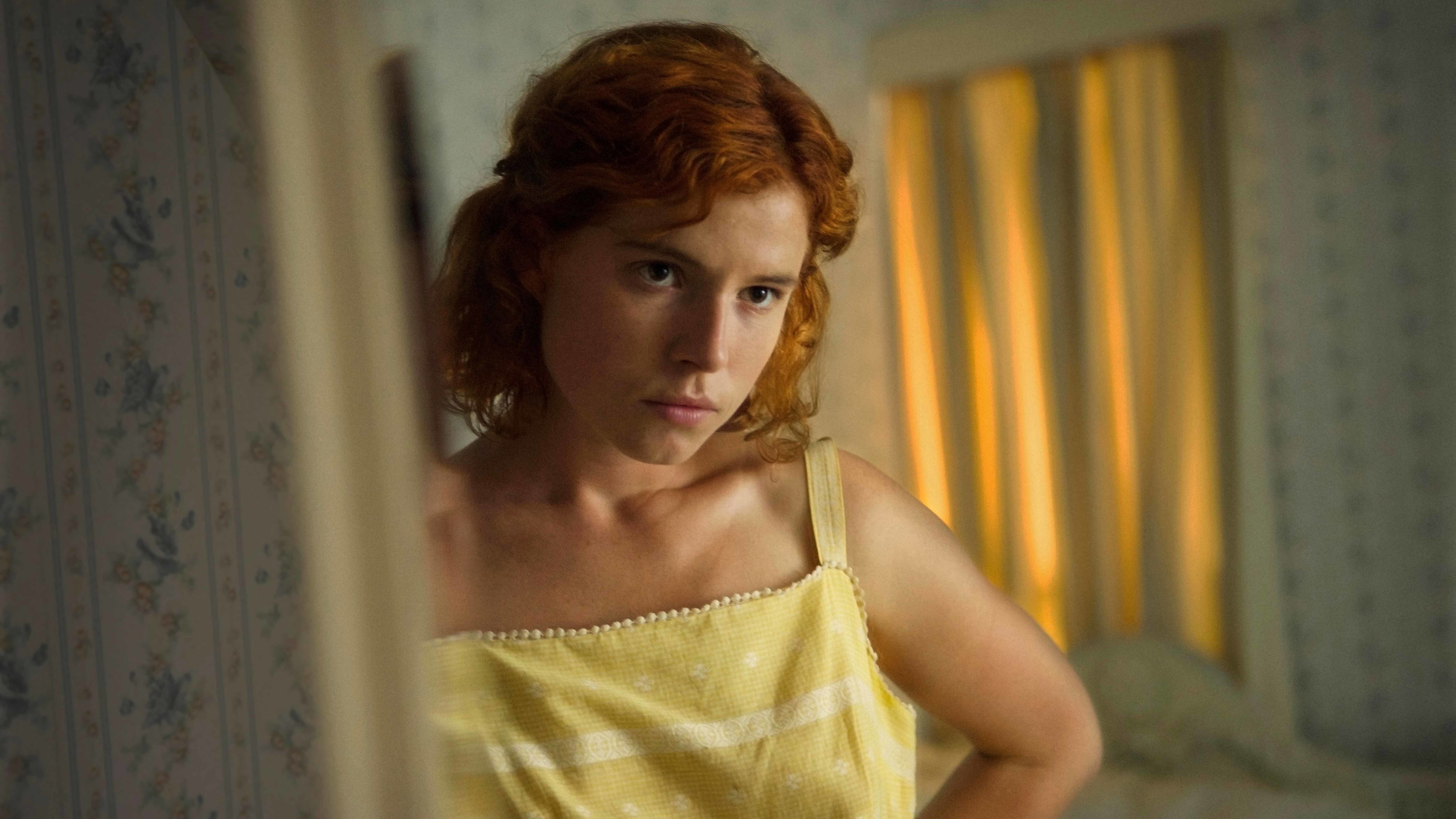 Moll (Jessie Buckley) gets ready to go out in the thriller Beast.