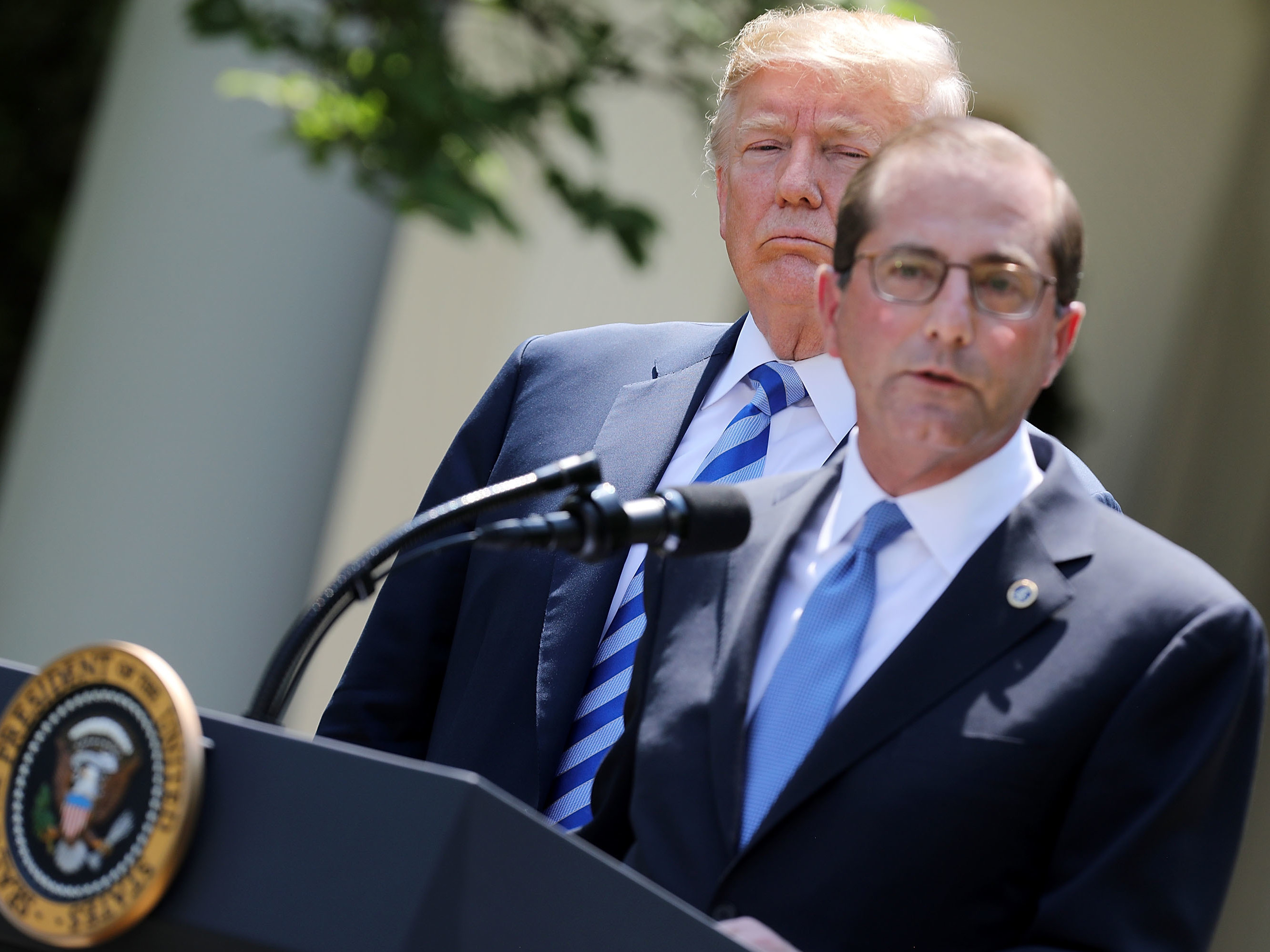 Health and Human Services Secretary Alex Azar talked Friday about the administration's plans to lower drug prices as President Trump looked on in the White House Rose Garden. (Getty Images)