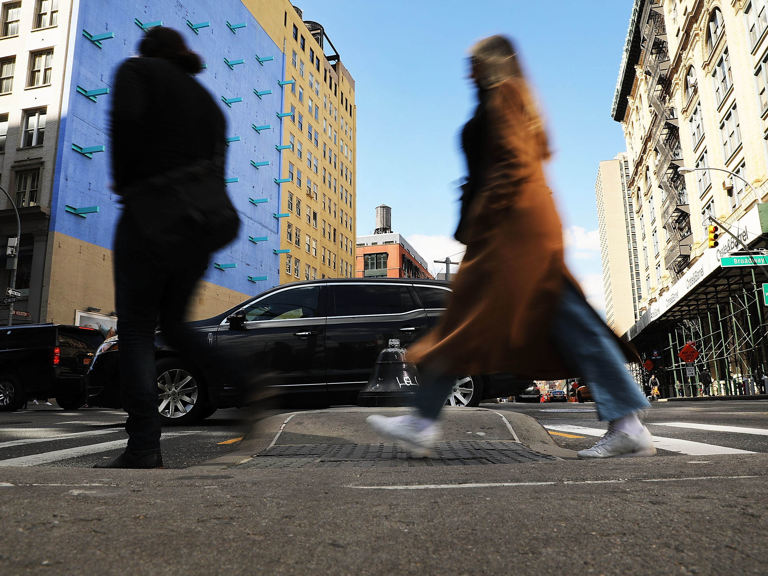 Pedestrians walk along a Manhattan street in New York City in March. A new report finds that SUVs are increasingly involved in fatal crashes with pedestrians.