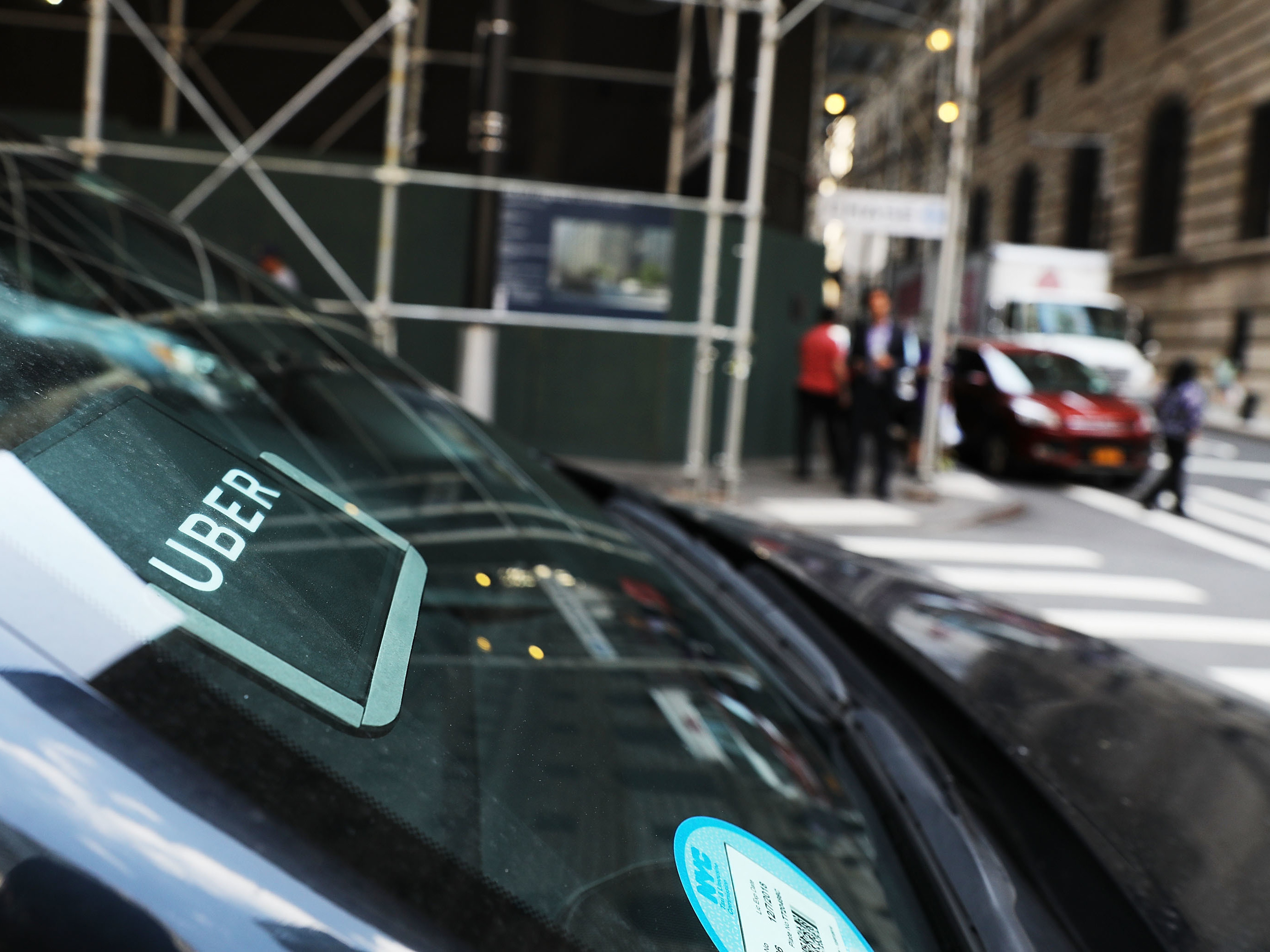 An Uber car waits for a client in Manhattan last June. Uber says customers, drivers and employees who are sexually harassed or assaulted won't have to go to arbitration, which required them to keep their stories private. (Getty Images)