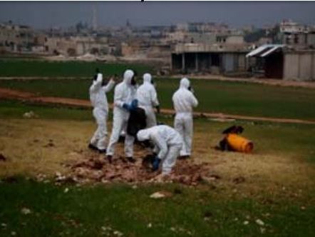 A team samples the impact site of a cylinder that contained chlorine gas, which was dropped on a field in the rebel-held Syrian city of Saraqeb on Feb. 4.