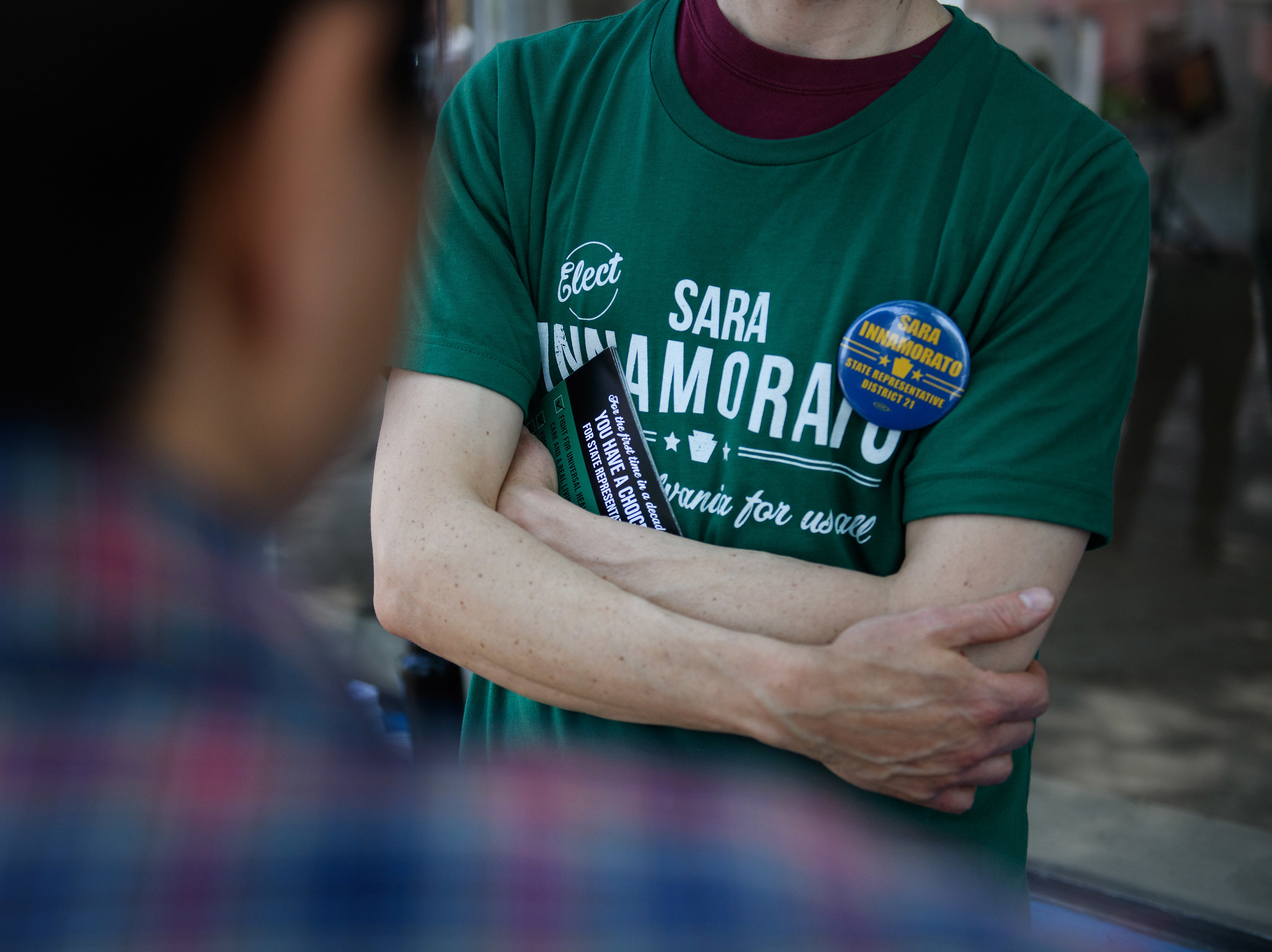 A campaign worker wears a shirt in support of Sara Innamorato outside a polling location at the Oakmont United Methodist Church in Pittsburgh. The first-time candidate declared victory over a five-term incumbent in the Democratic primary for House District 21. (Bloomberg via Getty Images)