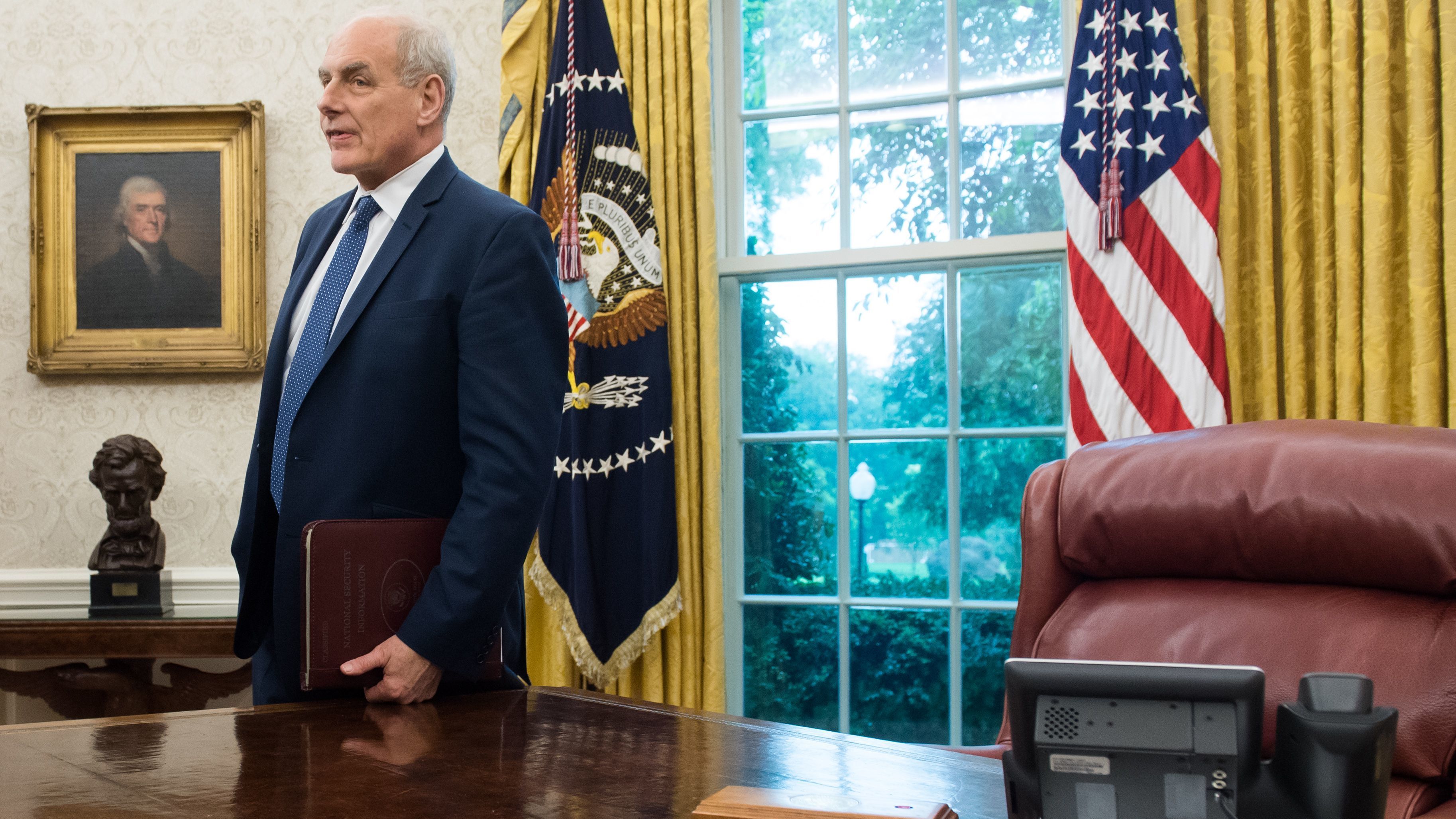 White House chief of staff John Kelly in the Oval Office of the White House Thursday. Kelly's recent comments about undocumented immigrants struck a nerve and inspired the hashtag #heyjohnkelly. (AFP/Getty Images)