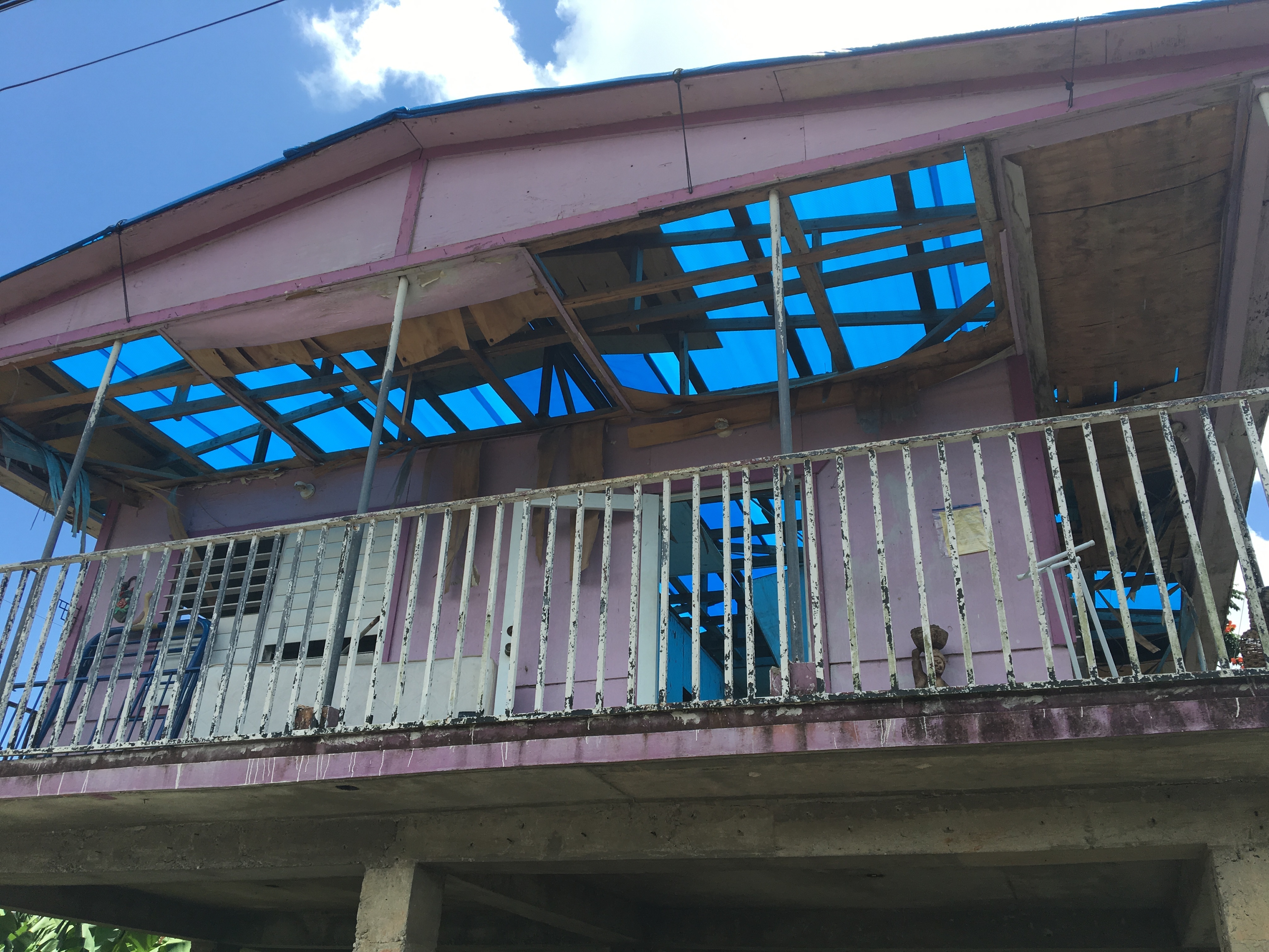 Rafaela Serrano's house in the municipality of Caguas is still roofless eight months after Hurricane Maria. Countless homes on the island remain damaged two weeks before the start of the next hurricane season. (NPR)