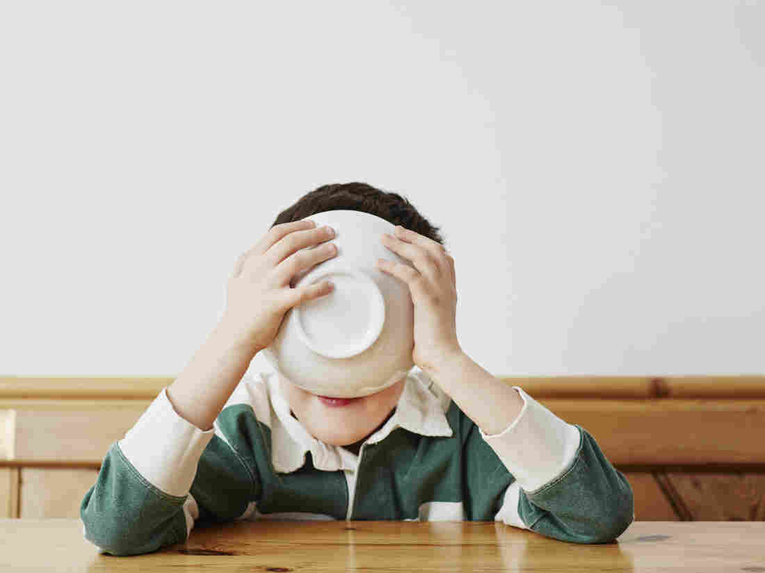 Boy drinking milk from bowl