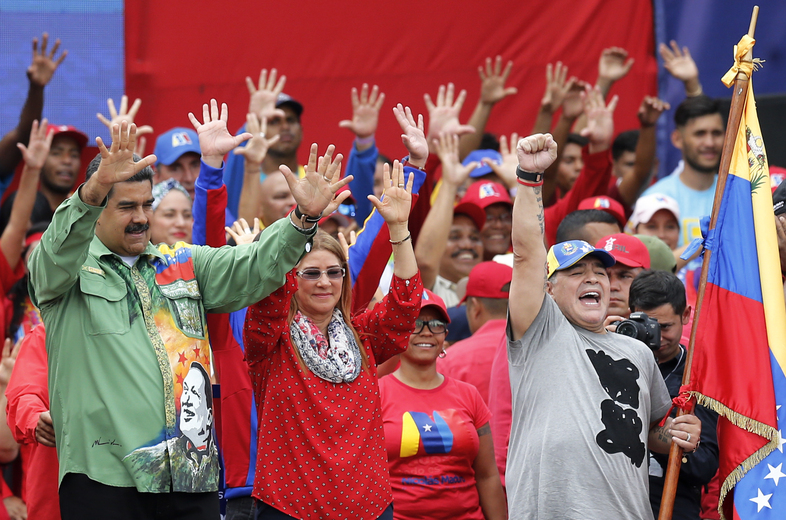 Venezuela's President Nicolás Maduro greets supporters during a closing campaign rally in Caracas, Venezuela, Thursday. Maduro is seeking a new six-year mandate. (Ariana Cubillos/AP)