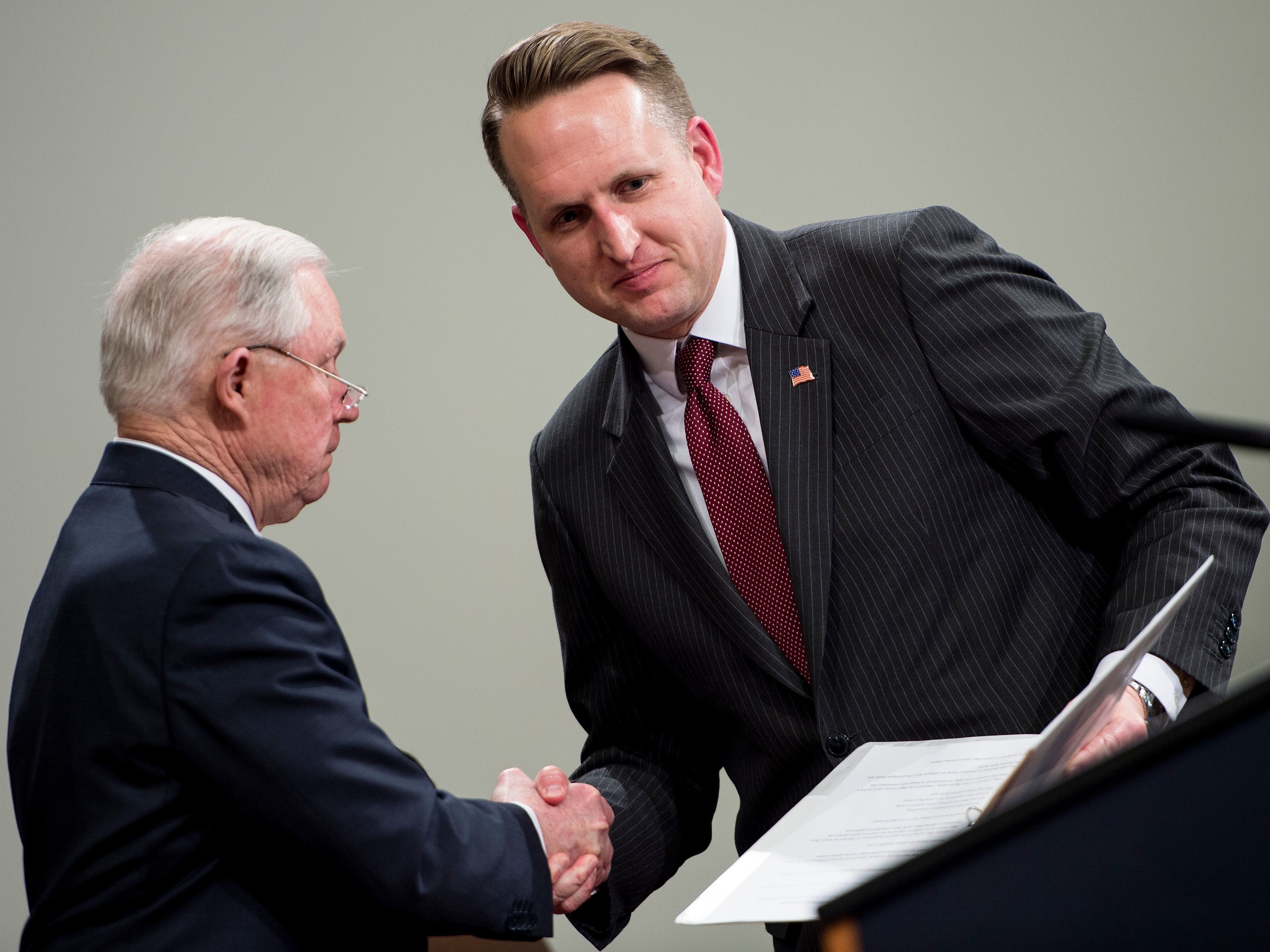 John Gore, acting head of the Justice Department's civil rights division, (right) shakes hands with U.S. Attorney General Jeff Sessions in Washington, D.C., in April.