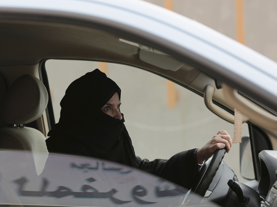 Saudi activist Aziza al-Yousef was arrested this week, along with other women's activists. In this March 29, 2014 photo, she drives a car on a highway in Riyadh as part of a campaign to defy Saudi Arabia's ban on women driving. (Hasan Jamali/AP)