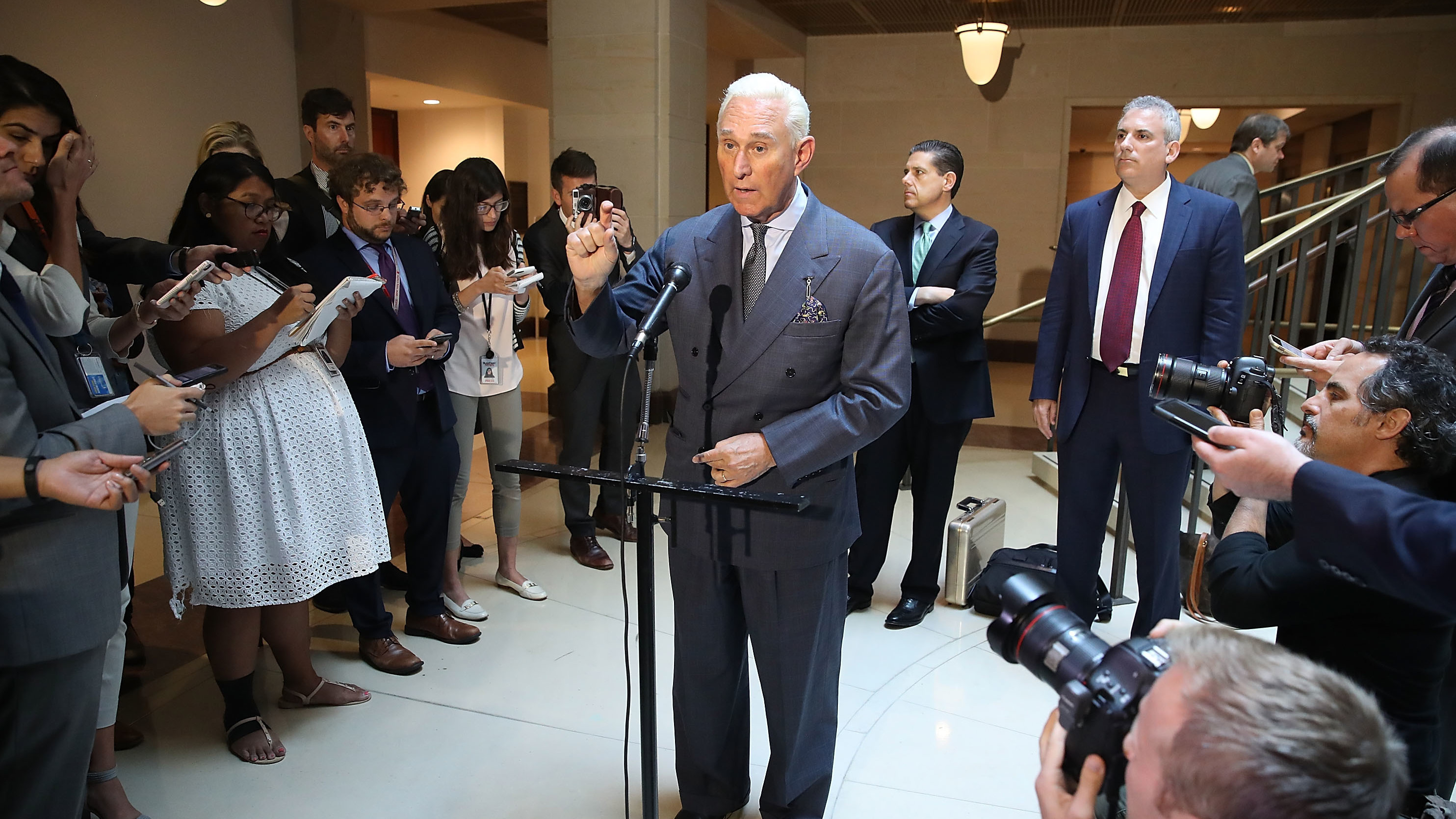 Roger Stone, a longtime ally of President Trump, speaks to the media after appearing before the House Intelligence Committee during a closed door hearing last September. On Sunday, Stone bemoaned the &quot;excesses and partisanship&quot; of Robert Mueller's investigation. (Getty Images)