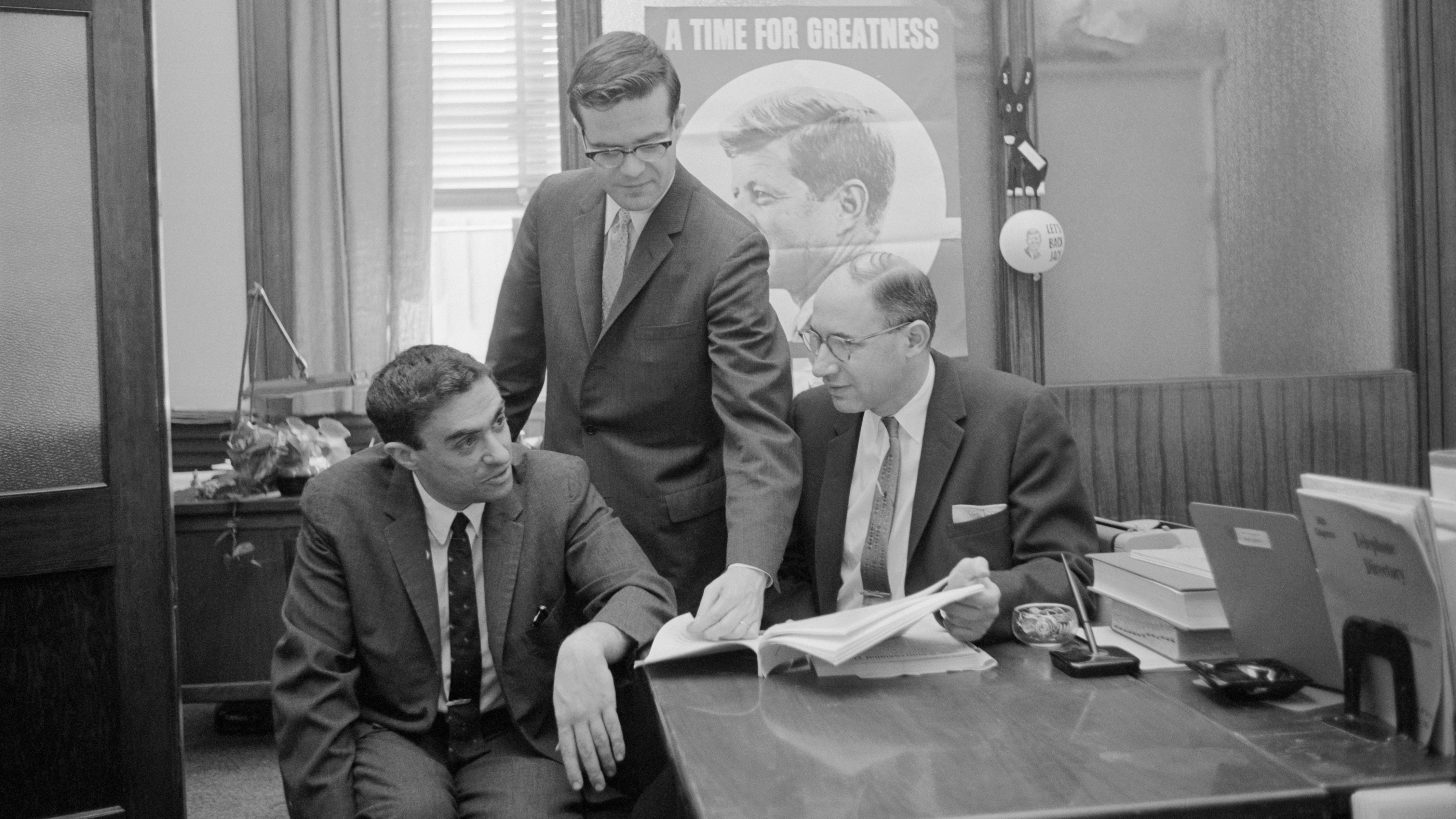 Richard Goodwin (left) worked for John F. Kennedy, first on his presidential campaign and then in the White House. He also wrote influential speeches for President Lyndon Johnson. Goodwin is seen here with Ted Sorensen (center) and Myer Feldman. (Bettmann Archive)