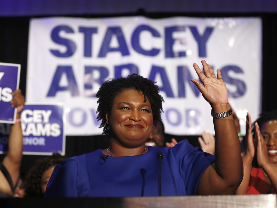 Democratic candidate for Georgia Governor Stacey Abrams waves to supporters on Tuesday after speaking at an election night watch party in Atlanta. (John Bazemore/AP)