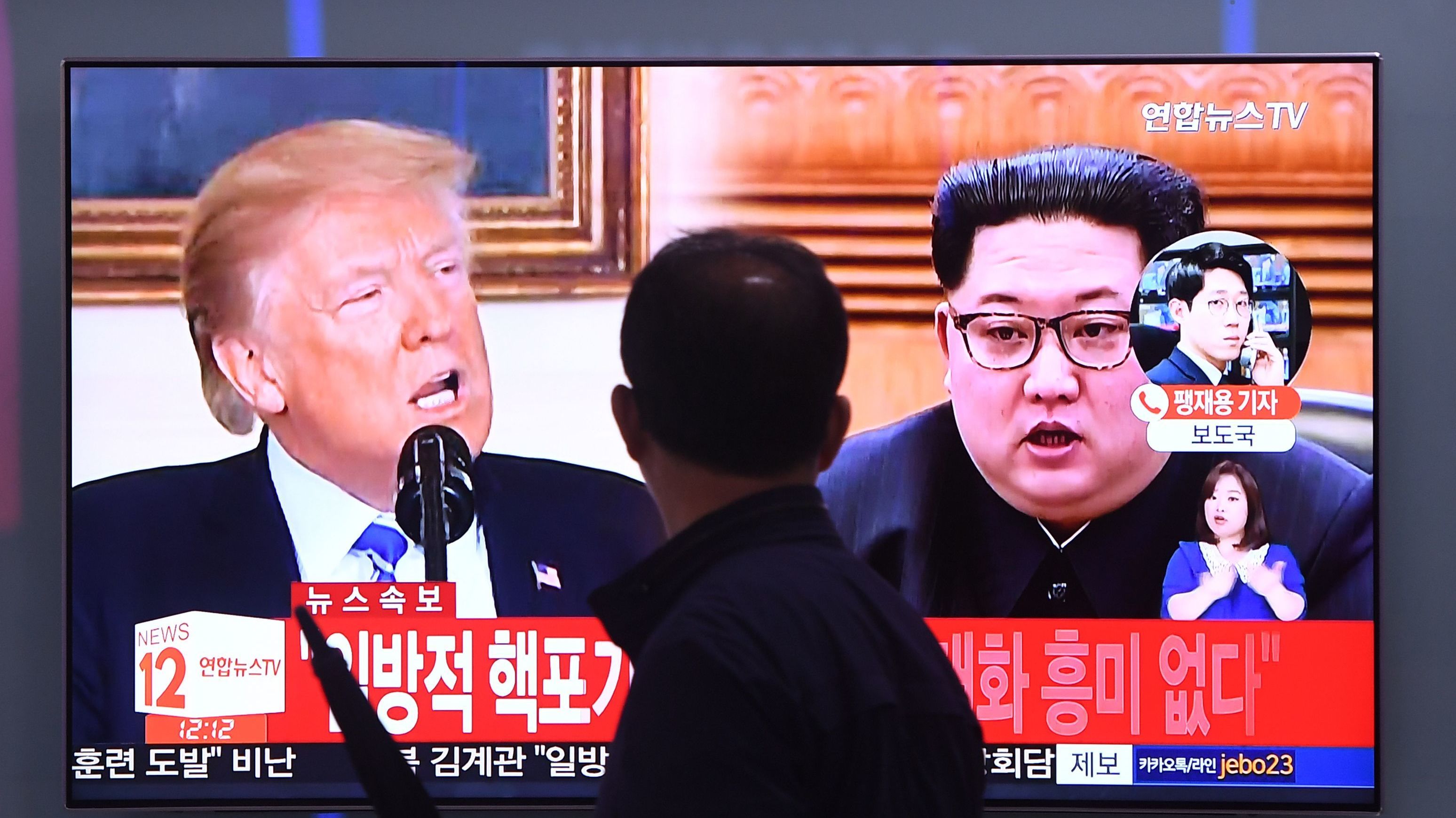 Images of President Trump and North Korean leader Kim Jong Un are shown in Seoul earlier this month. The two men are scheduled to meet on June 12, but there are doubts about when or whether a meeting will occur. (AFP/Getty Images)