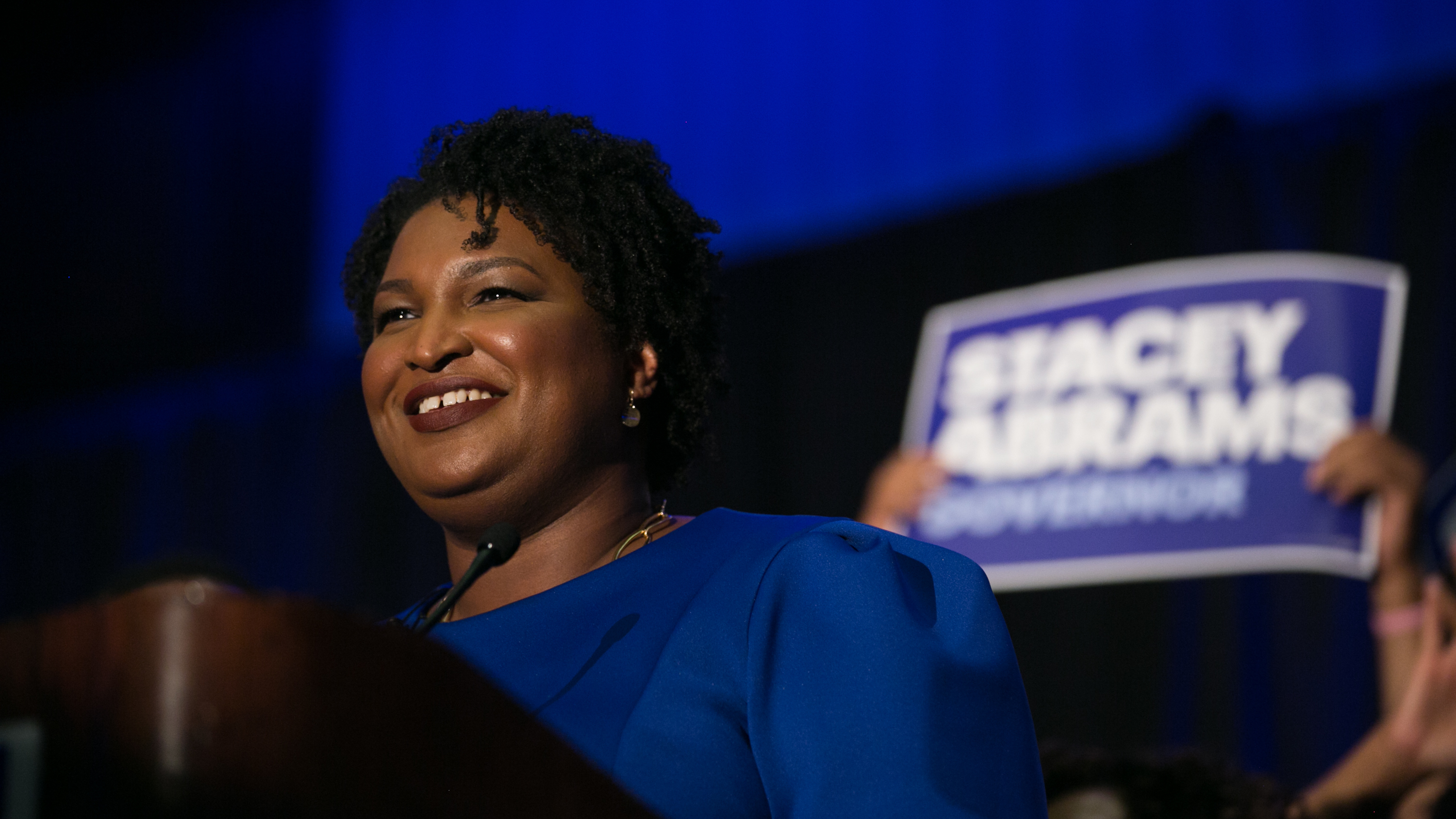 Georgia Democratic nominee for governor Stacey Abrams takes the stage to declare victory Tuesday night. Abrams is the first black woman to win a major-party nomination for governor in U.S. history. (Getty Images)
