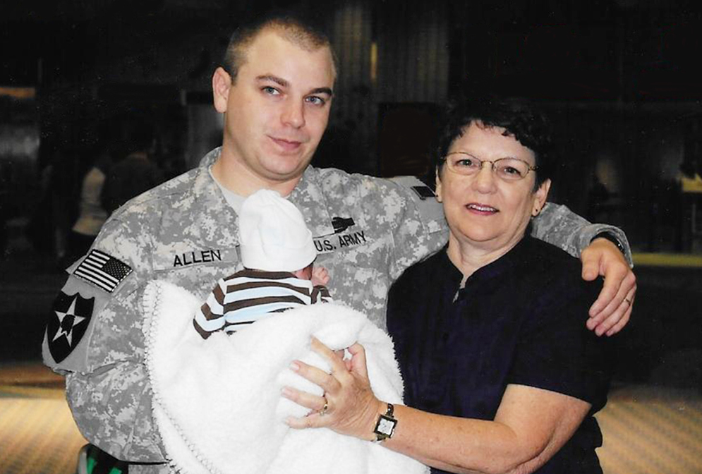 Cathy Sprigg (right) with her son, Army Spc. Robert Joseph Allen, at Tampa International Airport in 2010. Allen was headed back to Iraq after being on leave for the birth of his son. (Courtesy of Cathy Sprigg)