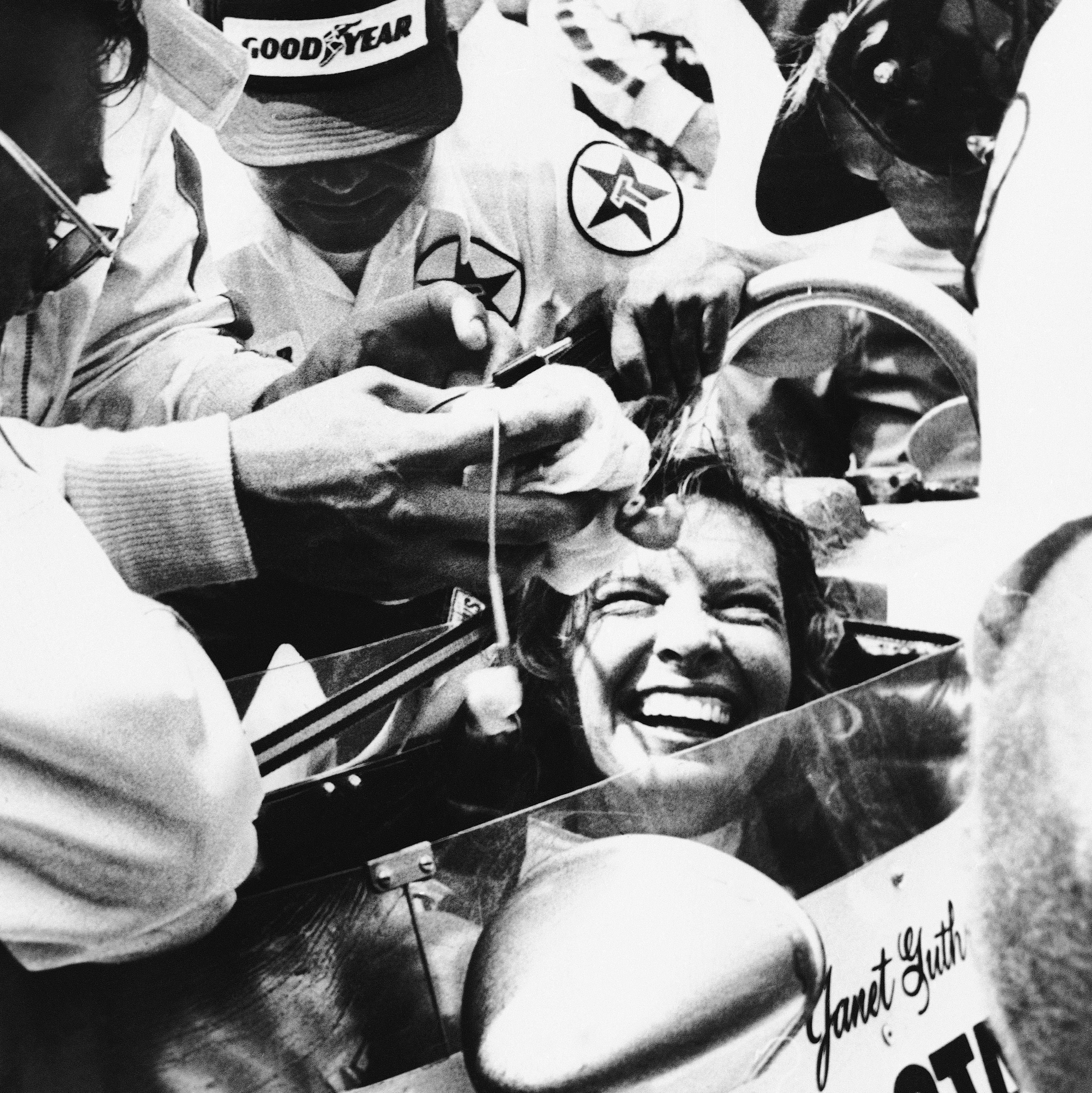 Janet Guthrie is all smiles as her pit crew swarms around her following the 62nd running of the Indianapolis 500 auto race in 1978 in Indianapolis, Ind.