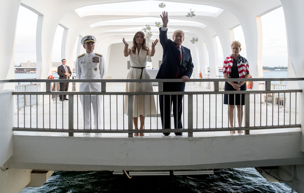 President Trump and first lady Melania Trump, accompanied by Adm. Harry Harris (left) and his wife, Bruni Bradley, throw flower pedals while visiting the Pearl Harbor Memorial in Honolulu, Hawaii, last Nov. 3. Trump has nominated Harris to be the U.S. ambassador to South Korea.