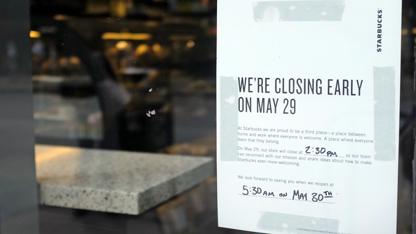 A sign is posted May 25 in the window of a Starbucks store, in Chicago. Starbucks will close more than 8,000 stores nationwide on Tuesday to conduct anti-bias training for employees.