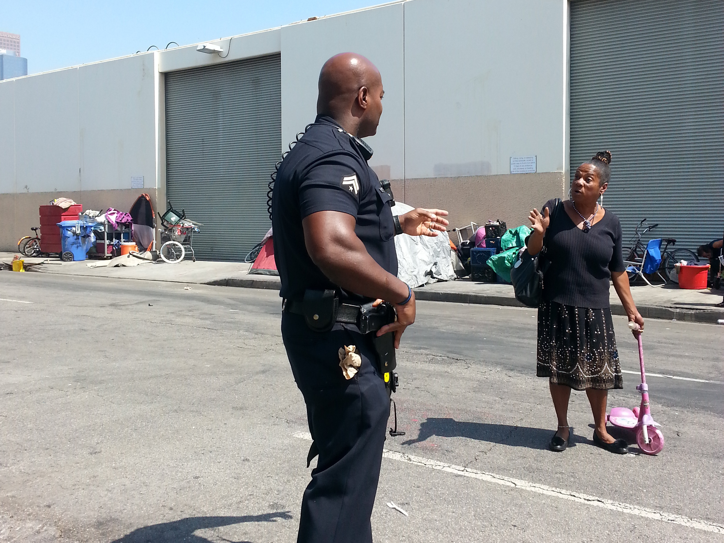 Women Of LA's Skid Row Tell Their Stories Through The Anger, Despair On Their Faces 1 LAPD Officer Deon Joseph talks with one of the women who call Skid Row home.