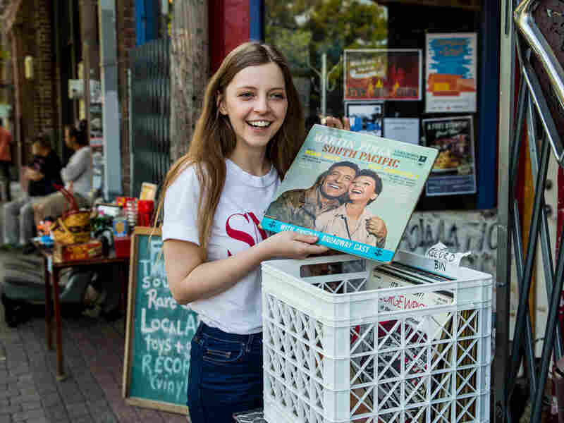 Jade Bird shuffles through a record bin in Deep Ellum, Dallas.