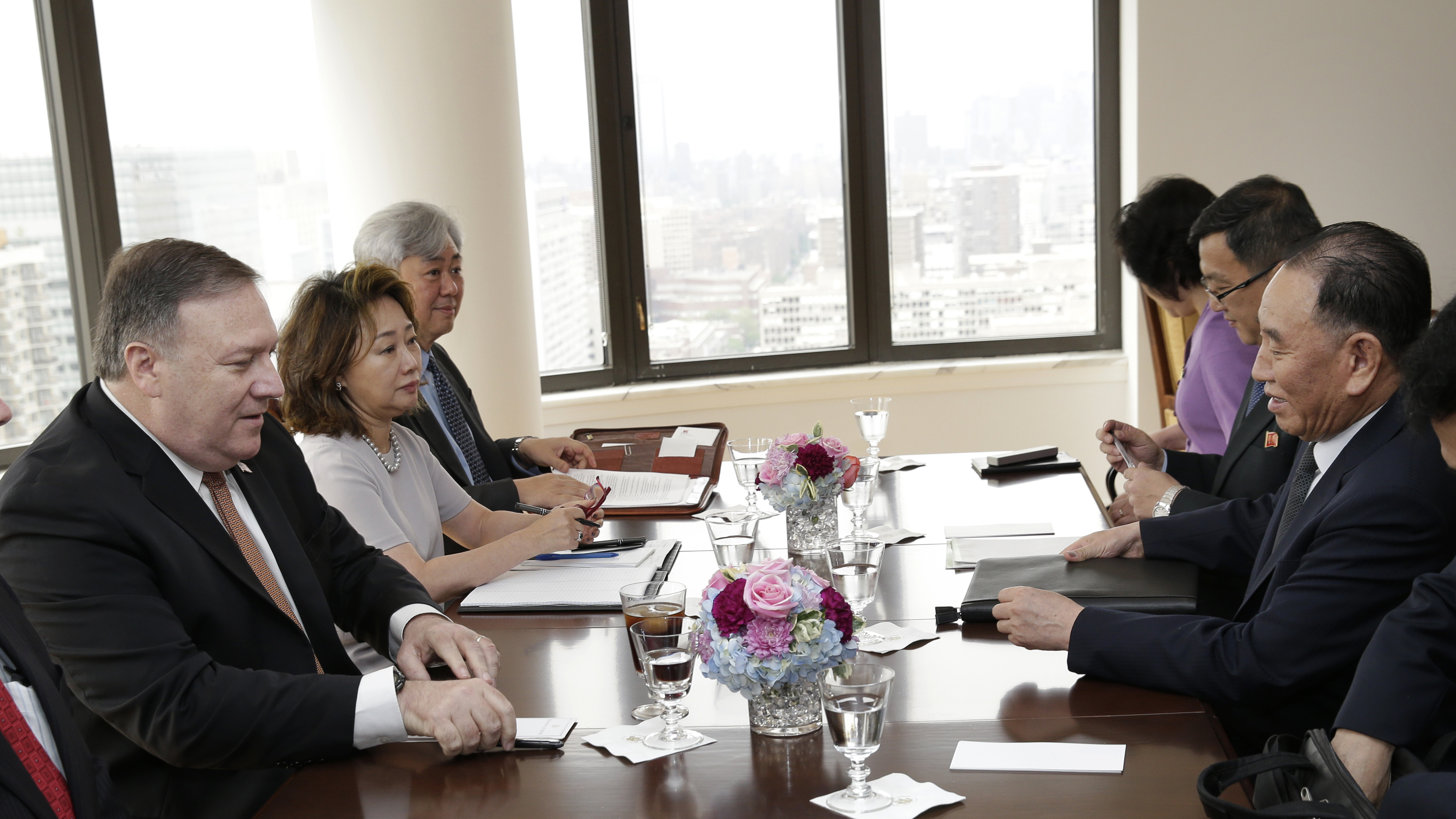 Kim Yong Chol, former North Korean military intelligence chief and one of Kim Jong Un's closest aides (second from right) and U.S. Secretary of State Mike Pompeo sit across from one another before the start of a meeting on Thursday in New York