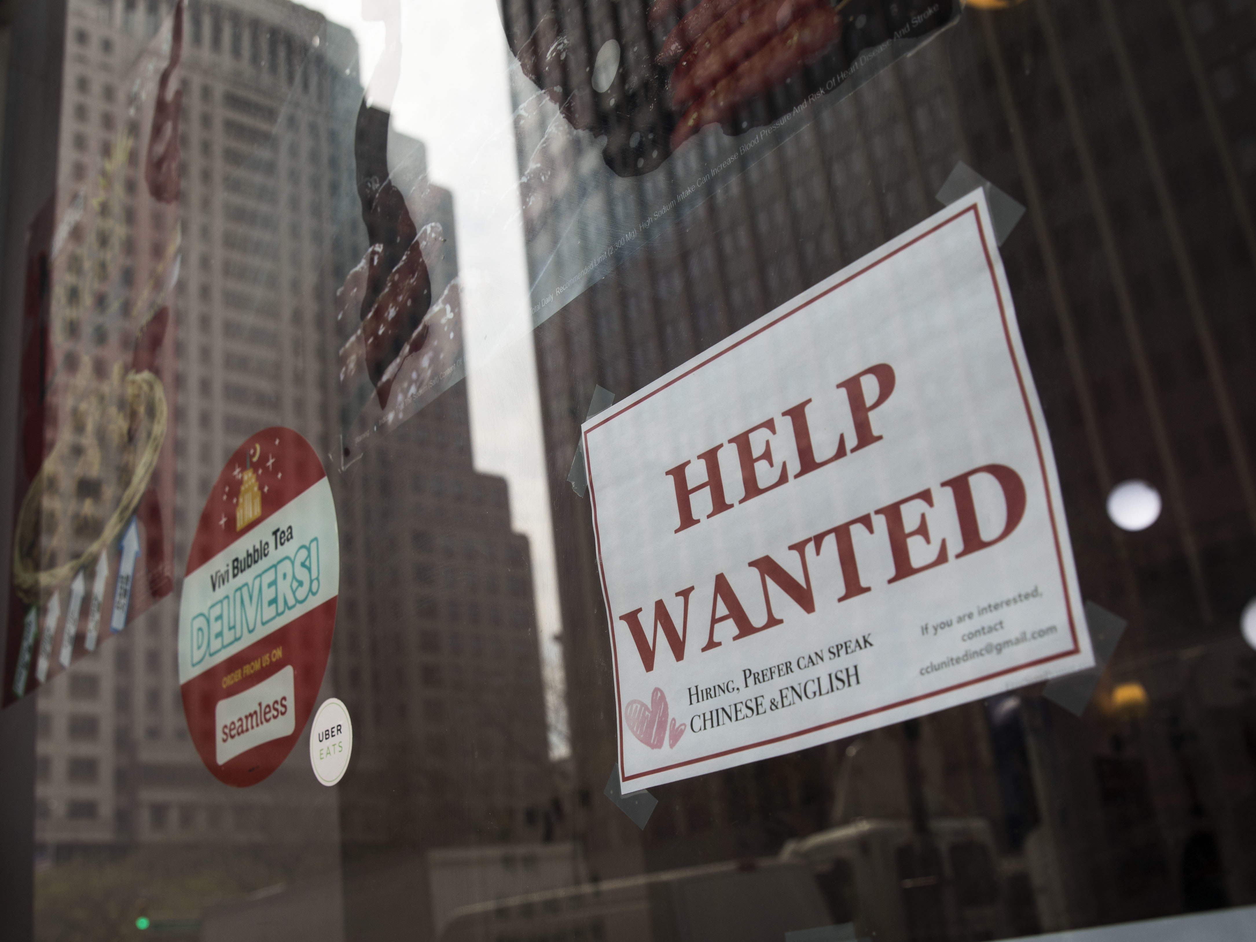 A &quot;help wanted&quot; sign hangs on a window of a restaurant in New York City. The U.S. economy gained a stronger-than-expected 223,000 jobs last month and the unemployment rate edged down to an 18-year low. (Getty Images)