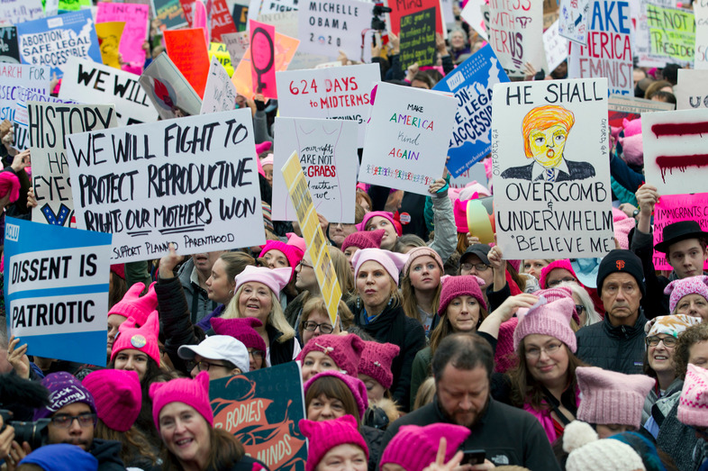Demonstrators with pink hats begin to gather in Washington for the Women's March on Jan. 21, 2017, the first full day of Trump's presidency. Now, many women have turned that energy into elections. (Jose Luis Magana/AP)