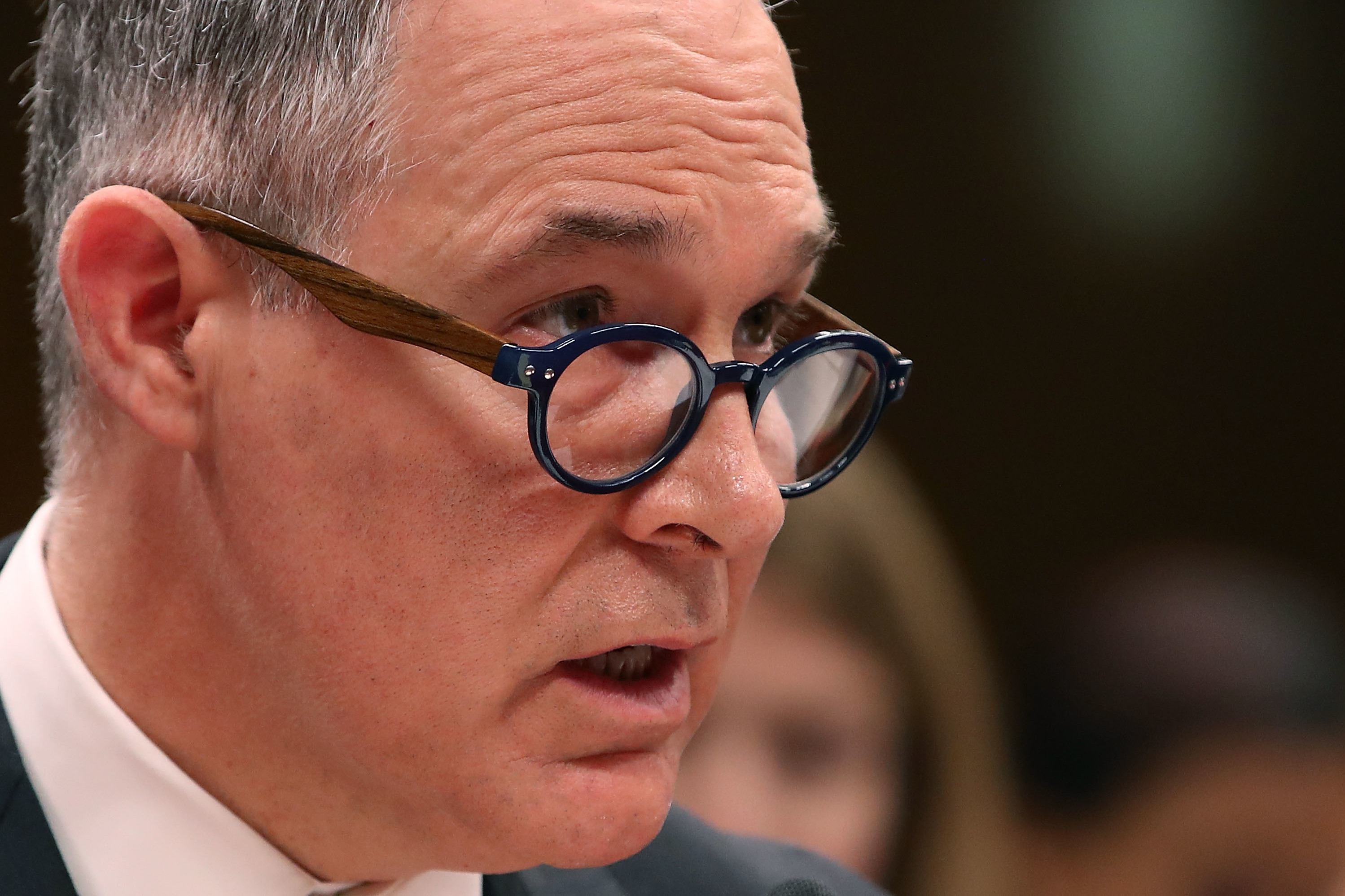 EPA Administrator Scott Pruitt, testifies during a Senate hearing last month. Pruitt is facing multiple investigations for his official spending. According to a memo released by House Democrats, one of Pruitt's aides said he asked her to run personal errands on his behalf. (Getty Images)