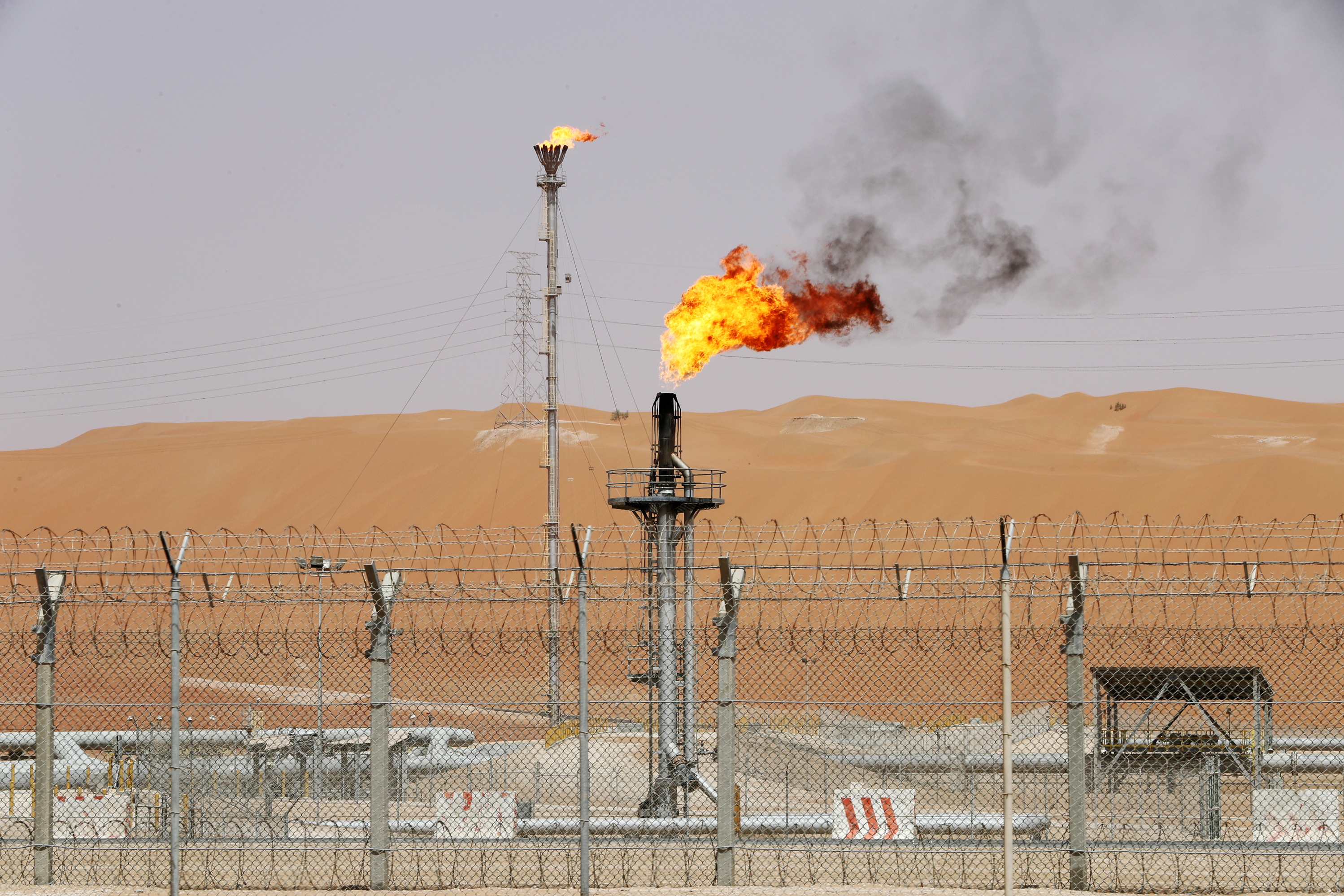 Flames are seen at the production facility of Saudi Aramco's Shaybah oilfield in May. (Reuters)