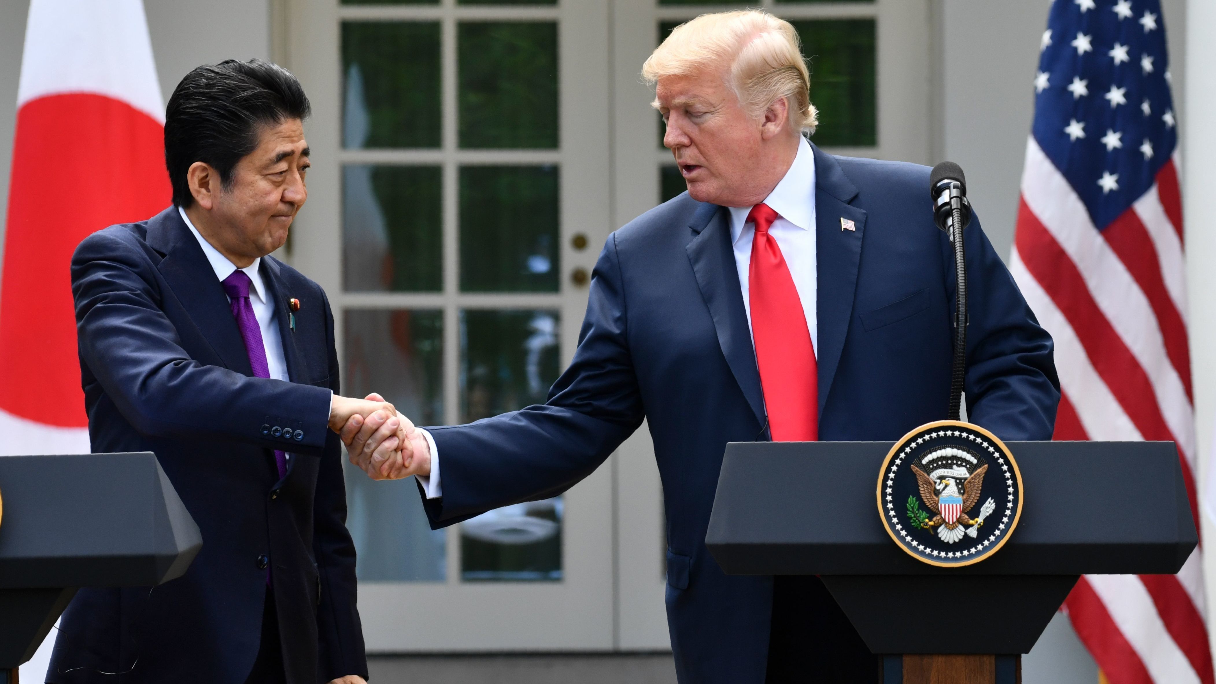 President Trump shakes hands with Japanese Prime Minister Shinzo Abe during a joint press conference in the Rose Garden of the White House on Thursday. (AFP/Getty Images)