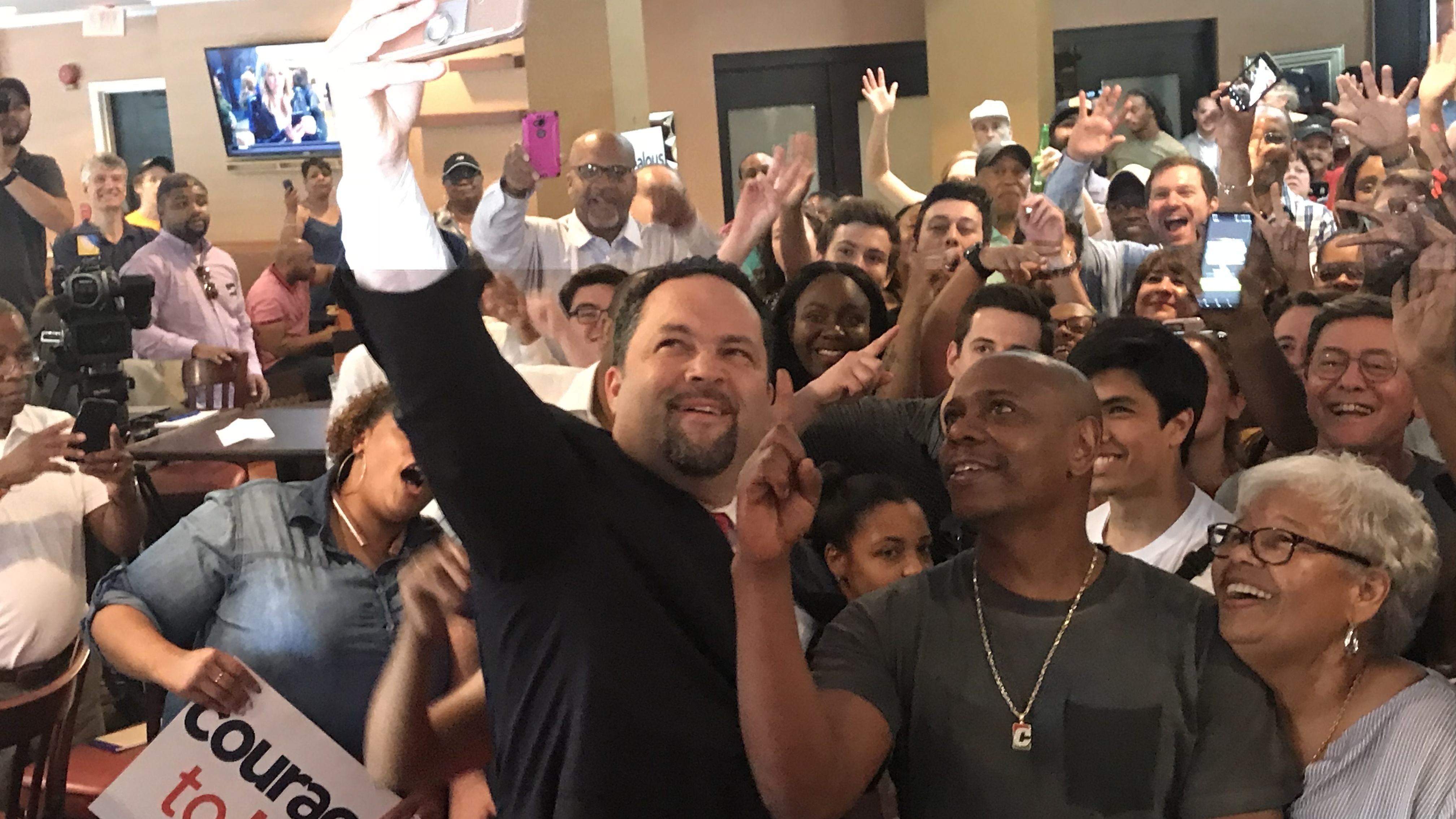 Dave Chappelle (second from right) put his celebrity to work at a campaign event for Ben Jealous (left) on Friday. (NPR)